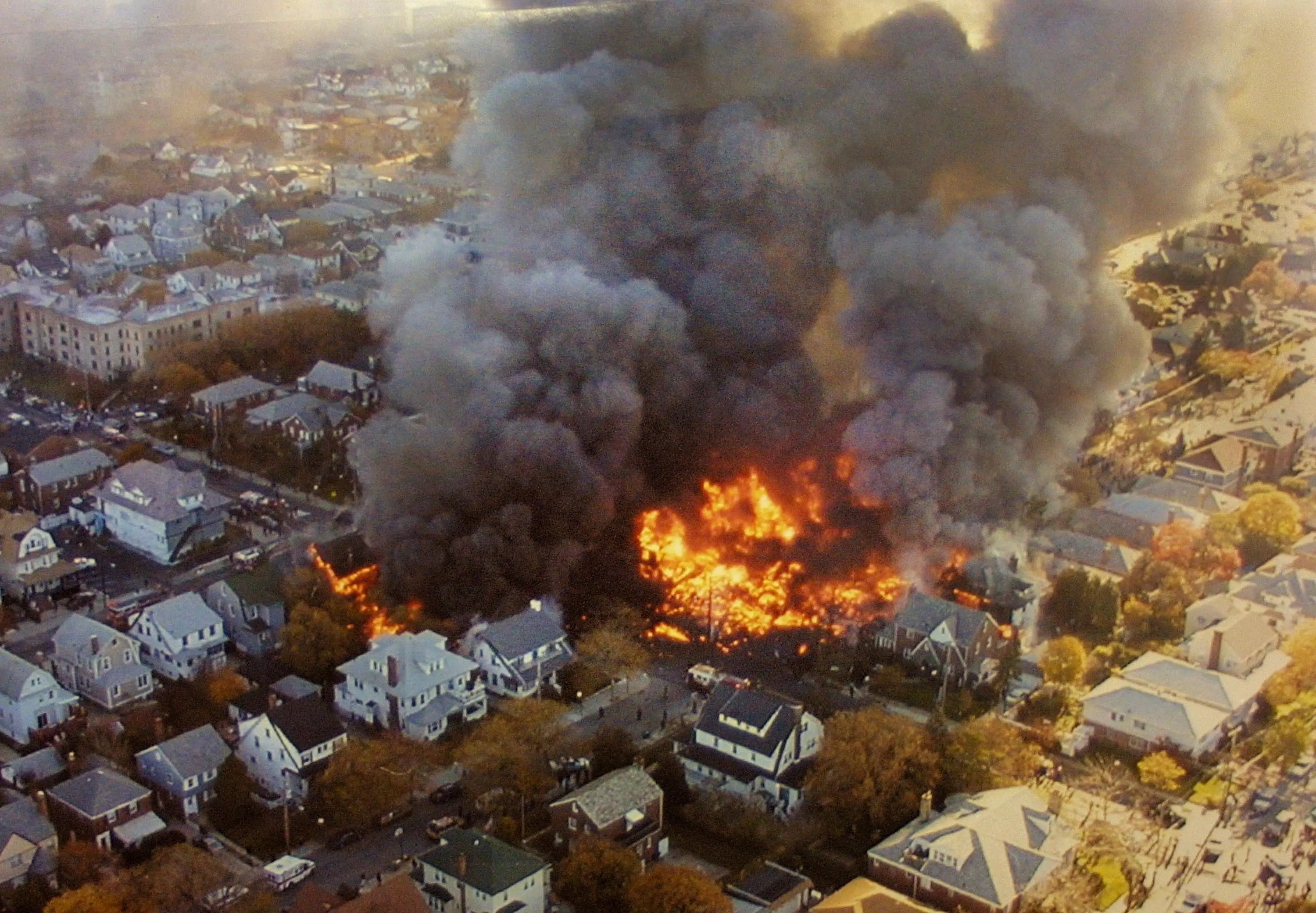 Flames erupted in the Belle Harbour neighbourhood after the plane crashed (NYPD/Getty Images)