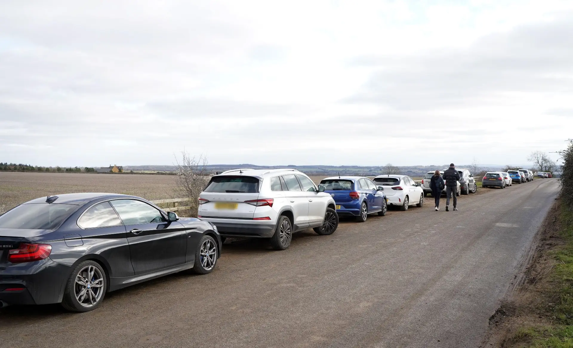 Cars were parked along the country lane in Chipping Norton.