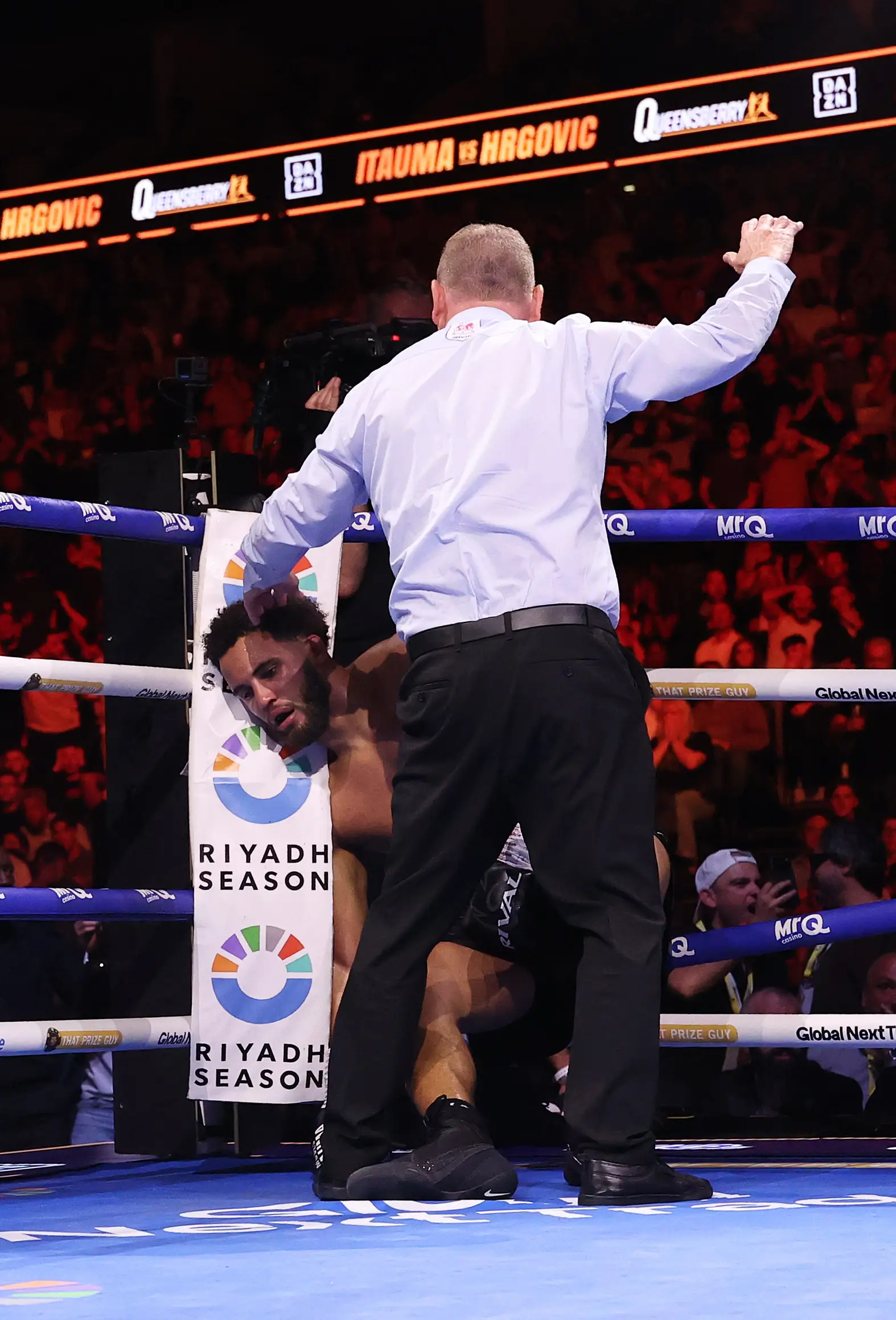 The ref intervened and stopped the fight just as the towel was thrown in. (Richard Pelham/Getty Images)