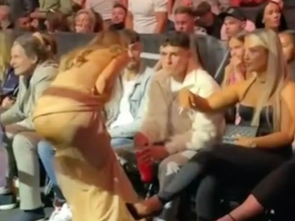 Foden leaned forward politely to hear Phillips' question, while Cooke remained less than impressed with the interaction (X)