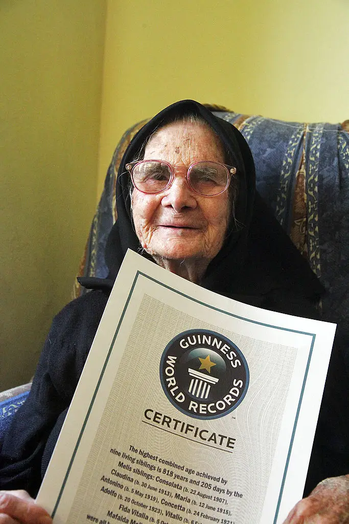 Consolata Melis, with the family's Guinness World Record Certificate (ETTORE LOI/AFP/GettyImages)