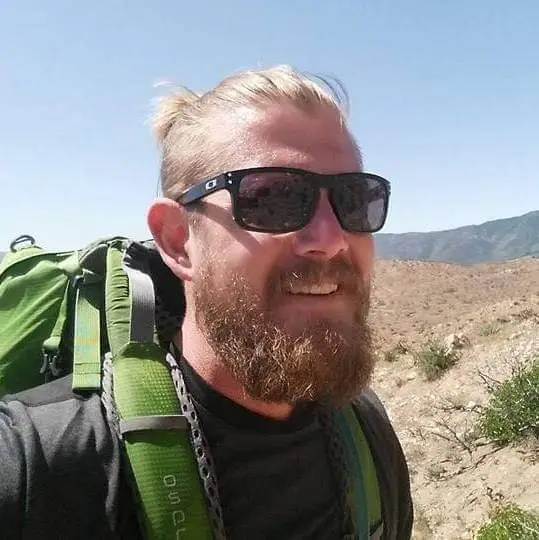 The adventurer was enjoying a camping trip with friends when he burnt his thumb (SWNS)