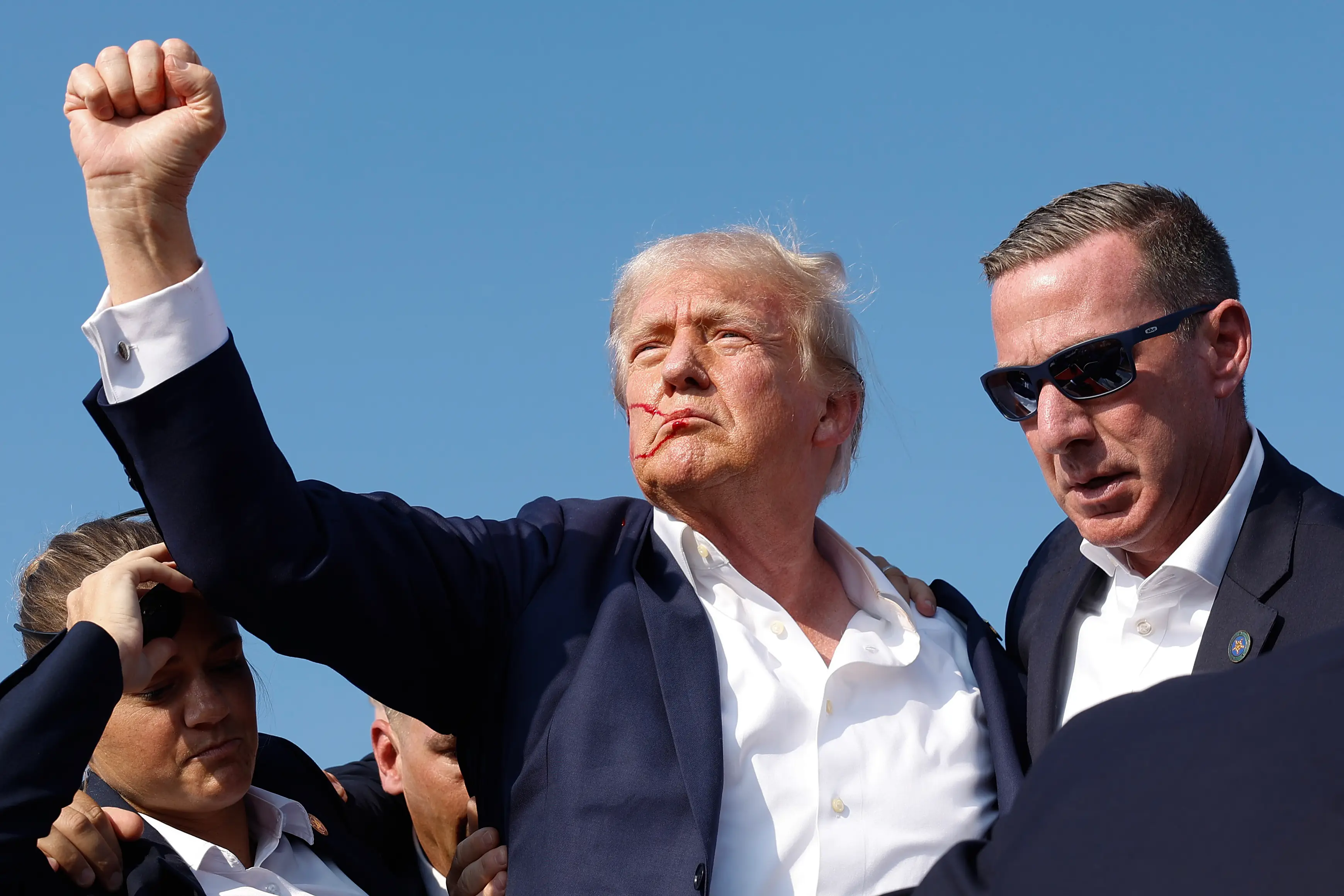 Geddes said it was 'just unbelievable' that Trump was 'not shielded' as they tried to get him off the stage, with the former US president able to pose for the crowd. (Anna Moneymaker/Getty Images)