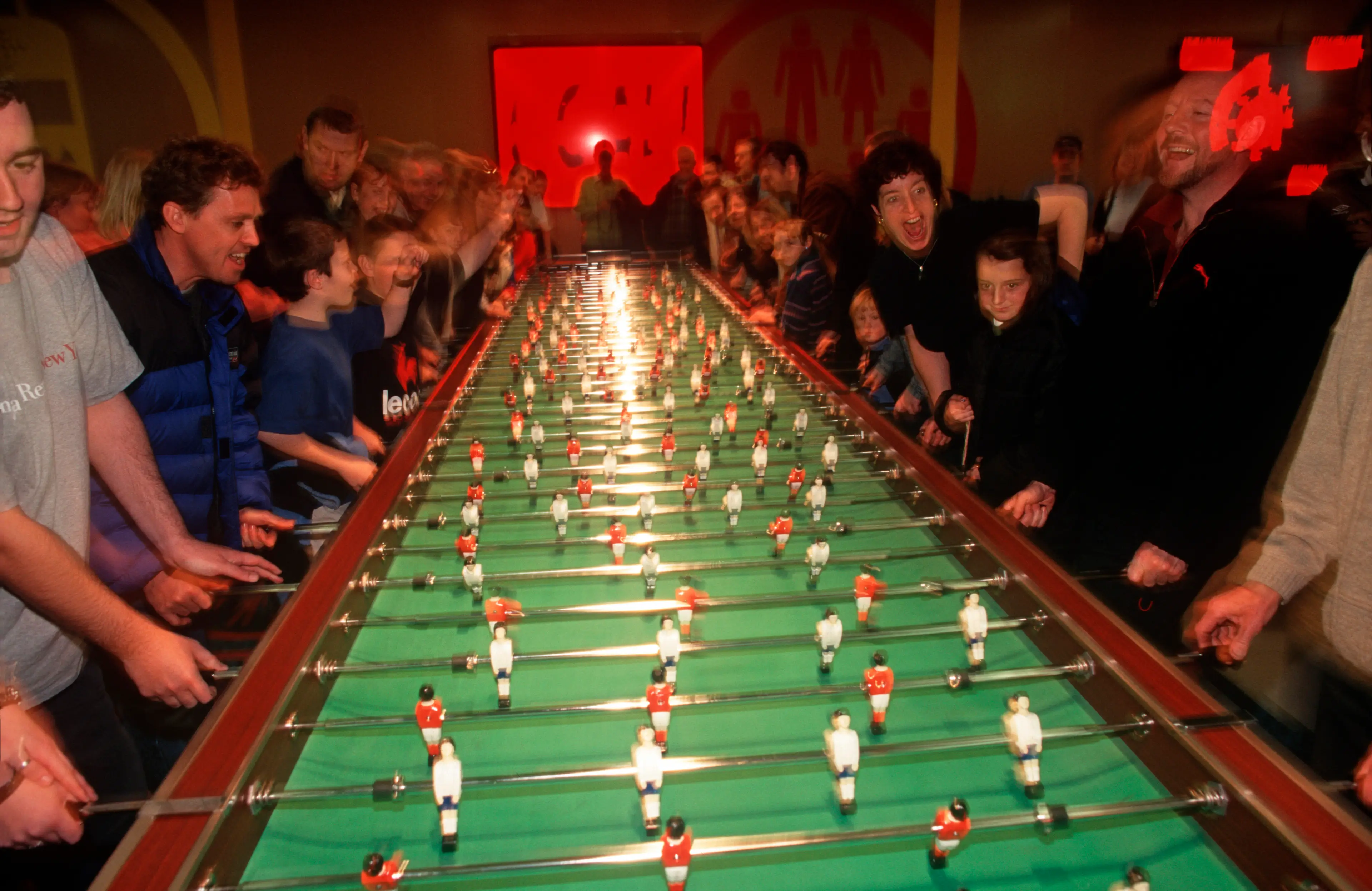Visitors enjoy a game of giant fussball table inside The Millennium Dome (Richard Baker / In Pictures via Getty Images Images)