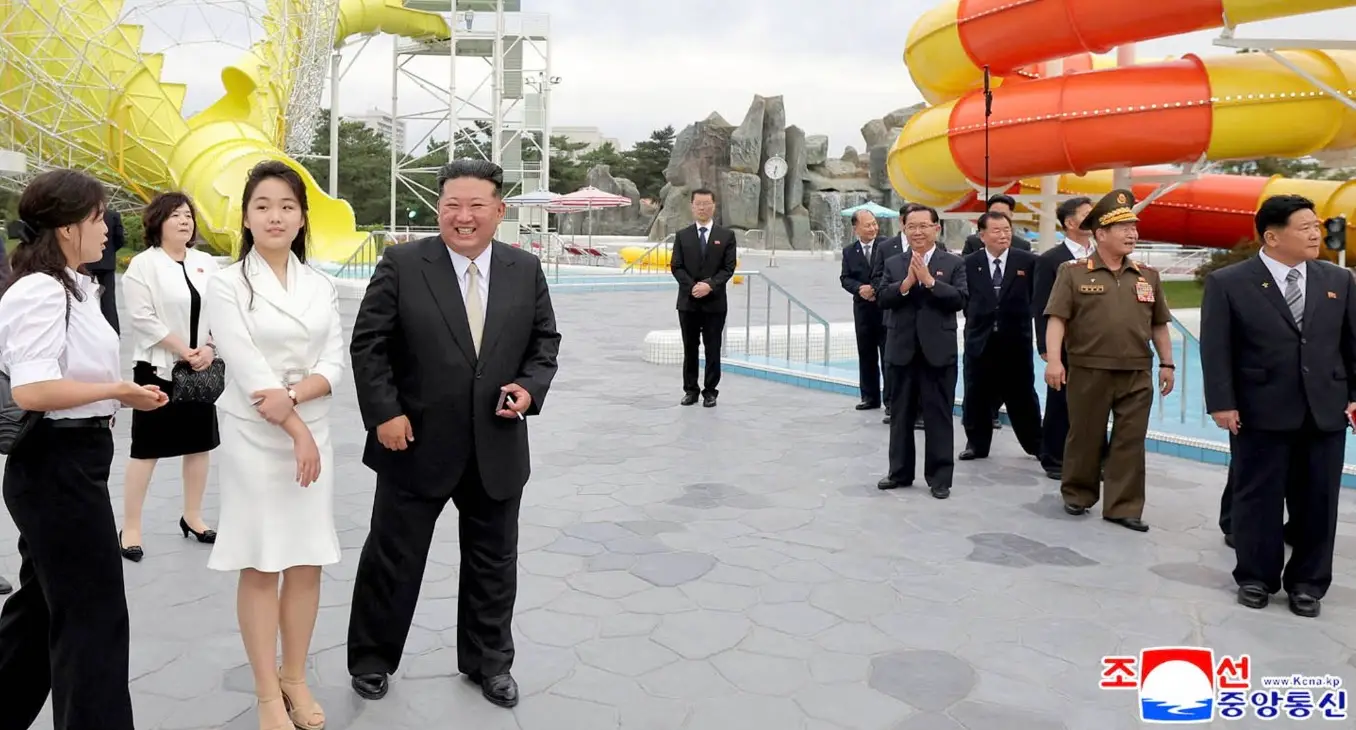Kim Jong-Un pictured grinning while checking out the water park which Wonsan Kalma boasts (KNCA)