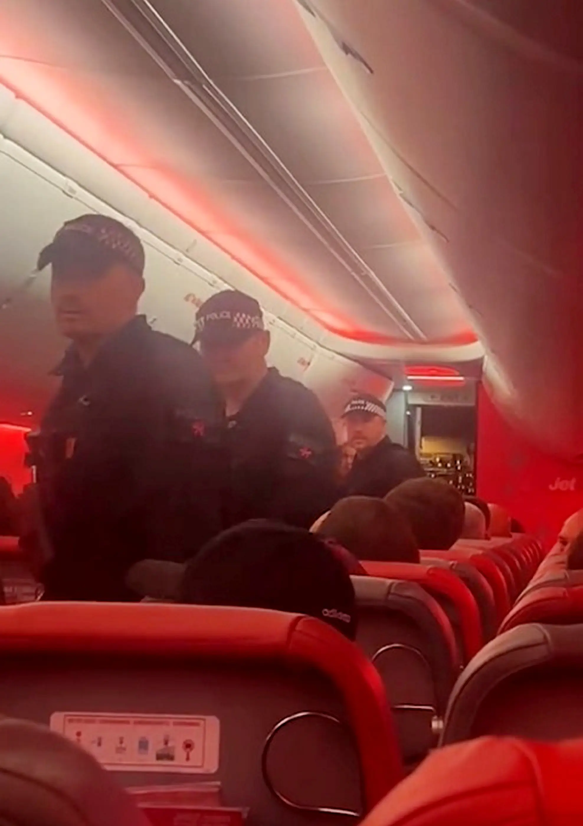 Witnesses said the man had been 'disruptive' on the flight and was restrained during the journey (SWNS)