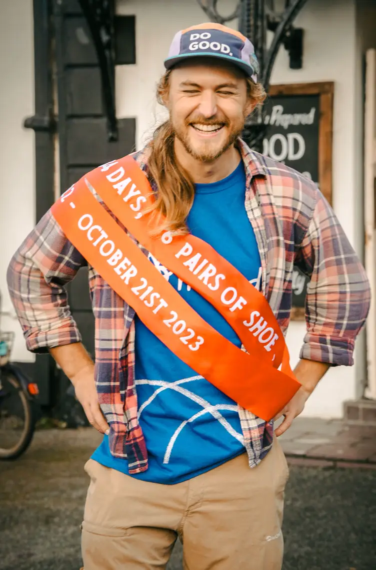 James celebrating walking around the entire coast of Great Britain (Supplied)