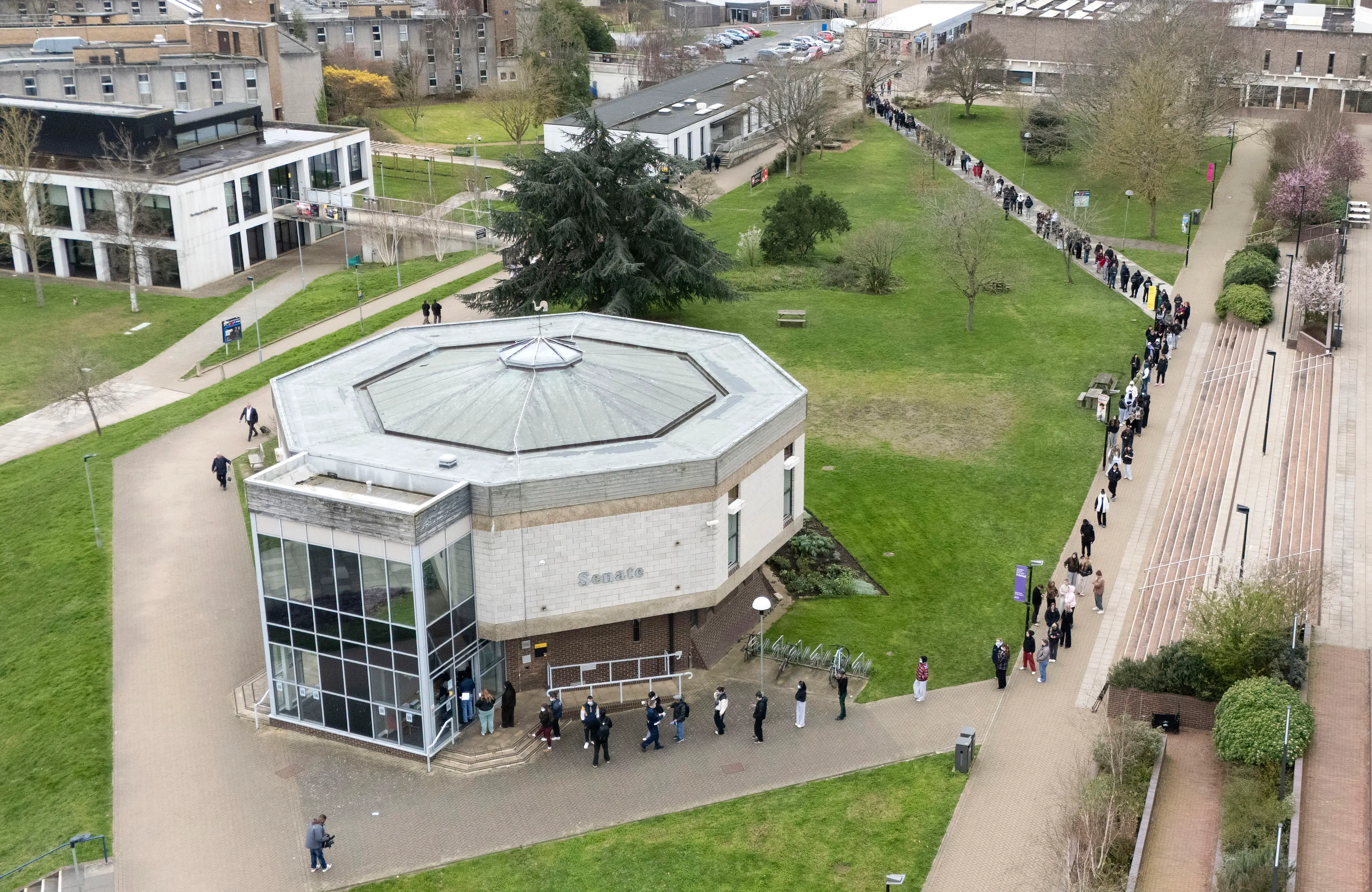 People queue up at the University of Kent for antibiotics, as health experts say they believe the outbreak is still contained in Kent (Gareth Fuller/PA Wire)