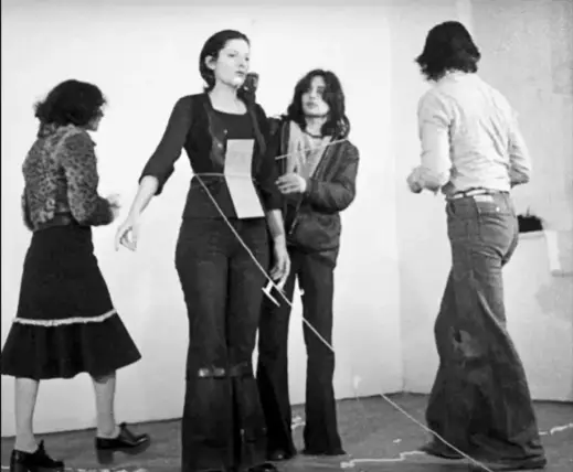 The performance started rather civil, with one person handing her a rose (Marina Abramovic Institute / YouTube)
