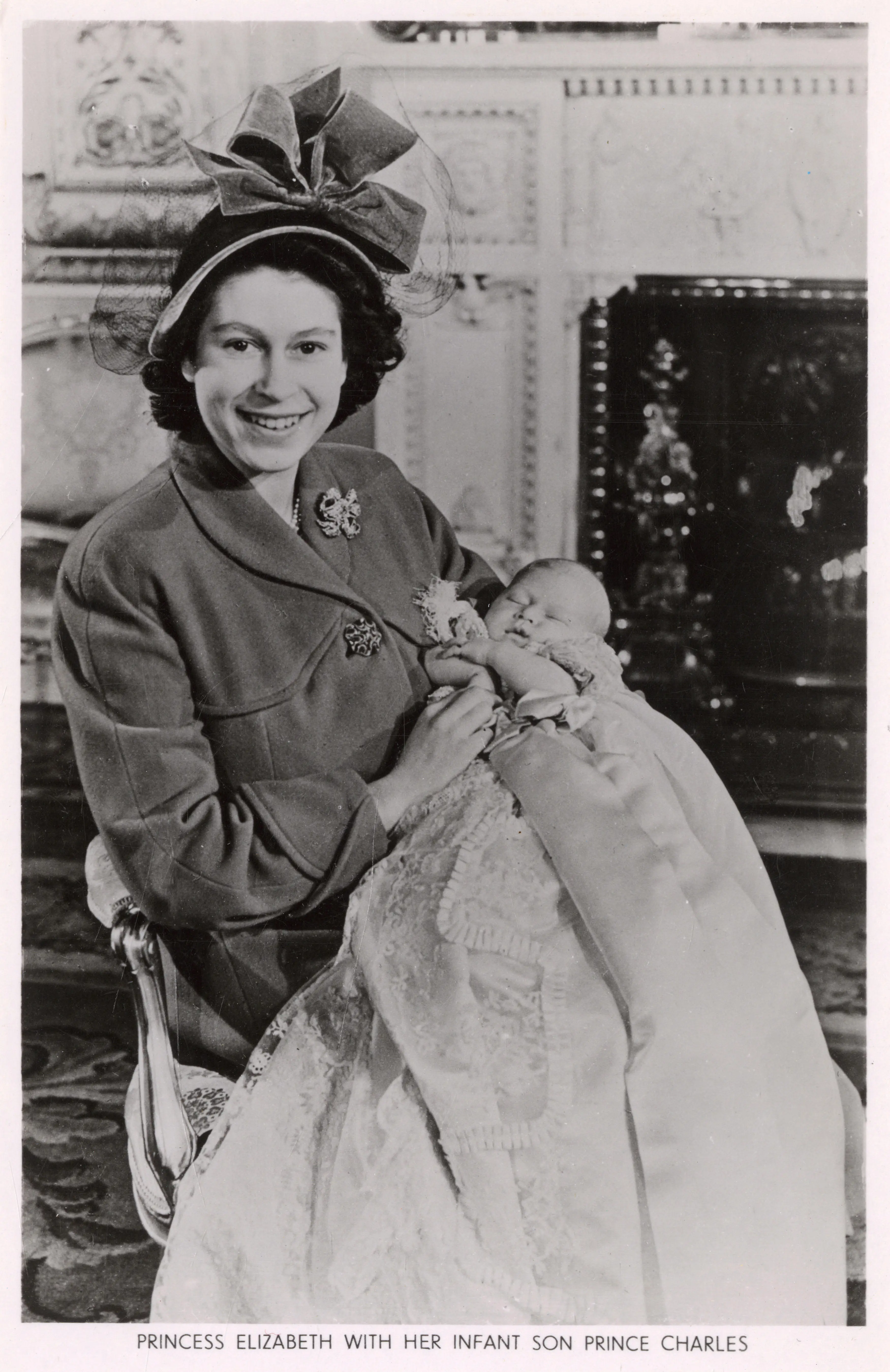 Queen Elizabeth and newborn Charles.