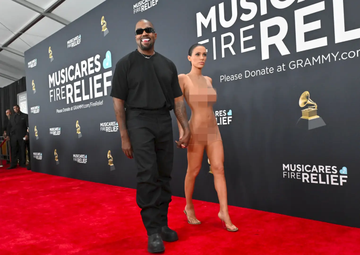 The couple on the red carpet after she took her coat off (Axelle/Bauer-Griffin/FilmMagic)