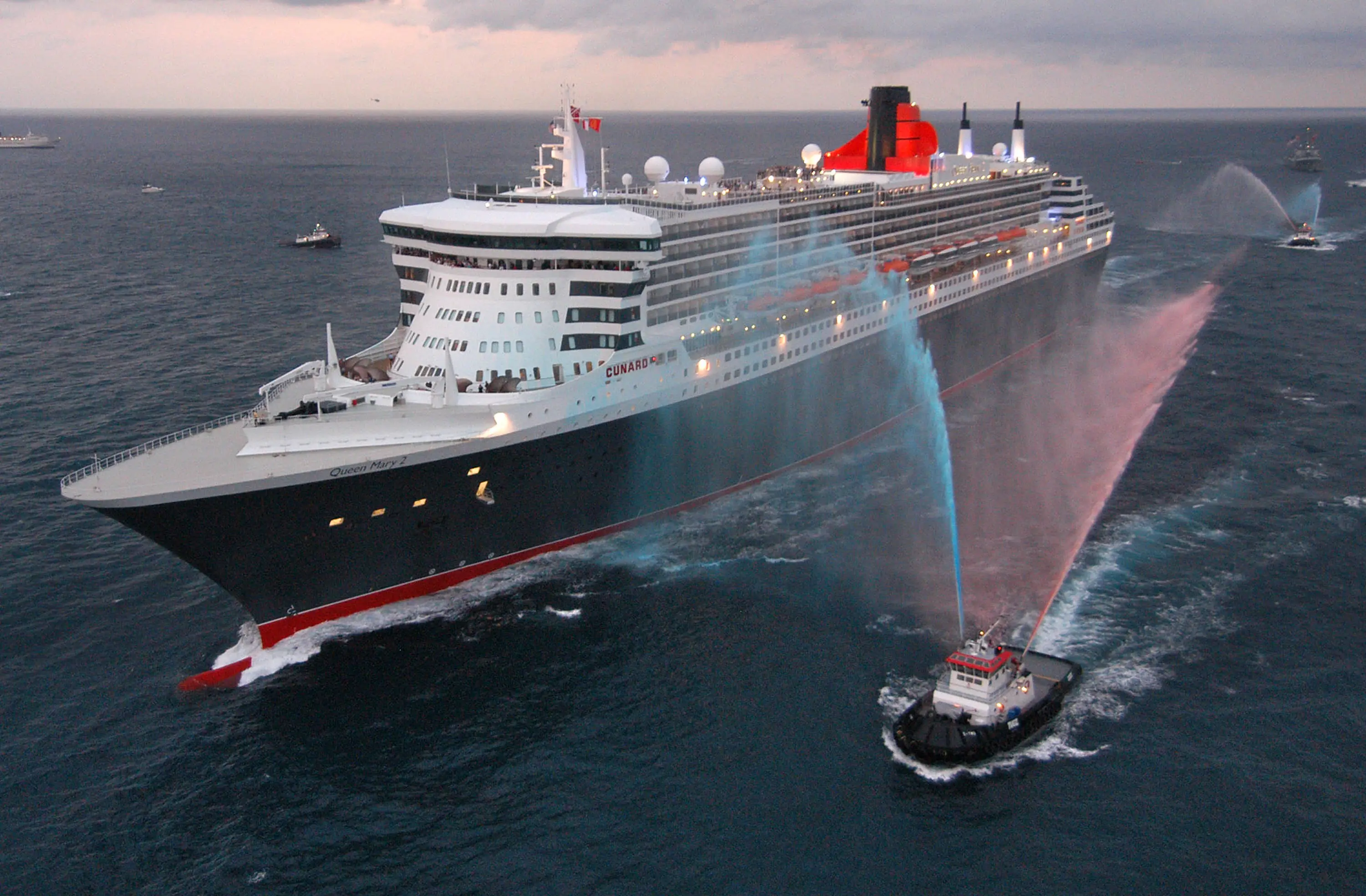 The water salute is a way for the tug boat to show appreciation. (Andy Newman/Cunard Line via Getty Images)