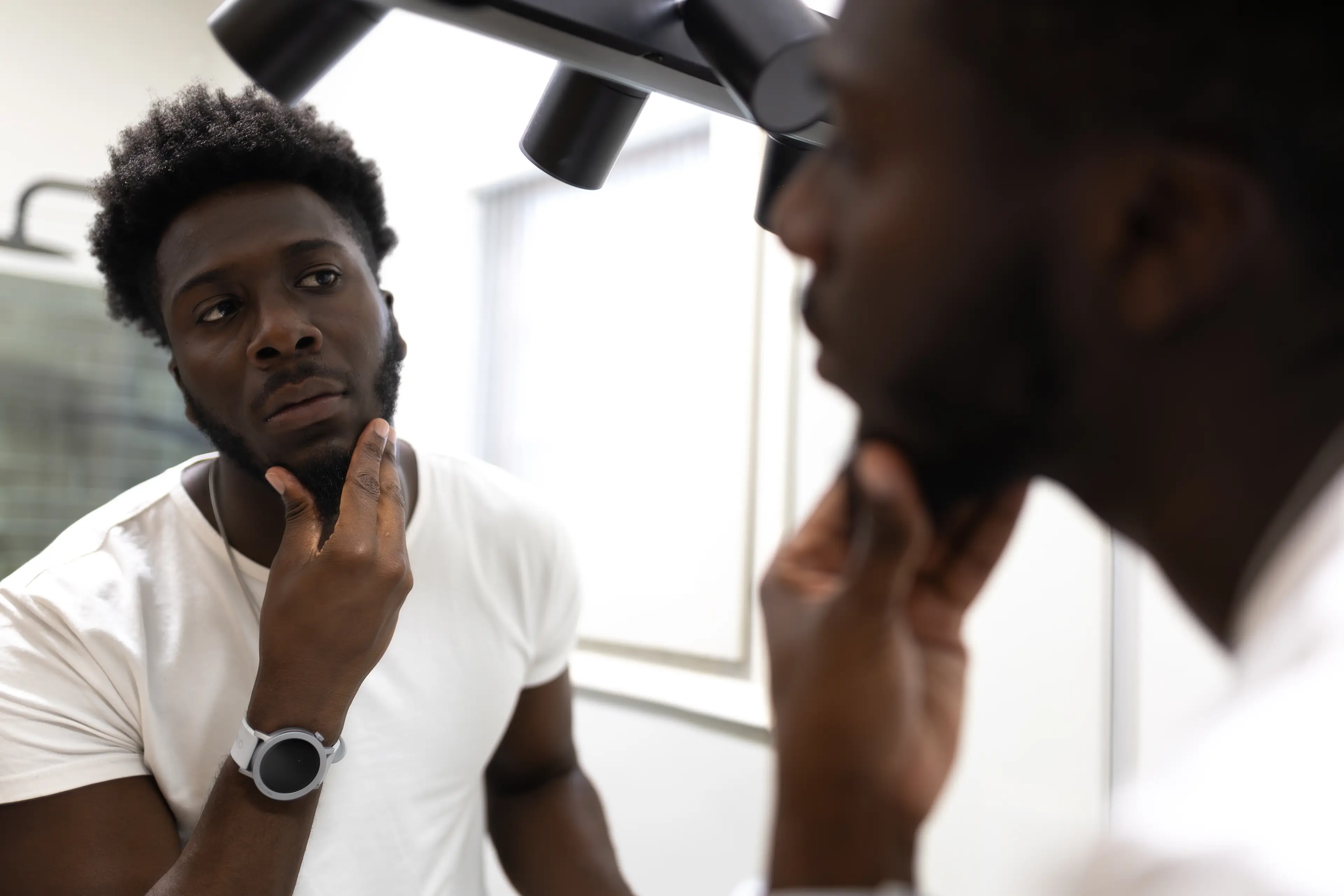 Dr Malik says it's a complex relationship but low levels can impact facial hair. (Getty Stock)