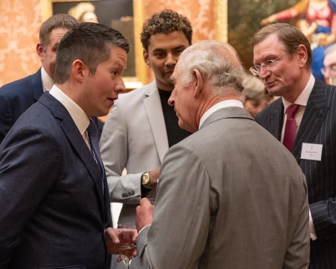 John pictured with King Charles III.