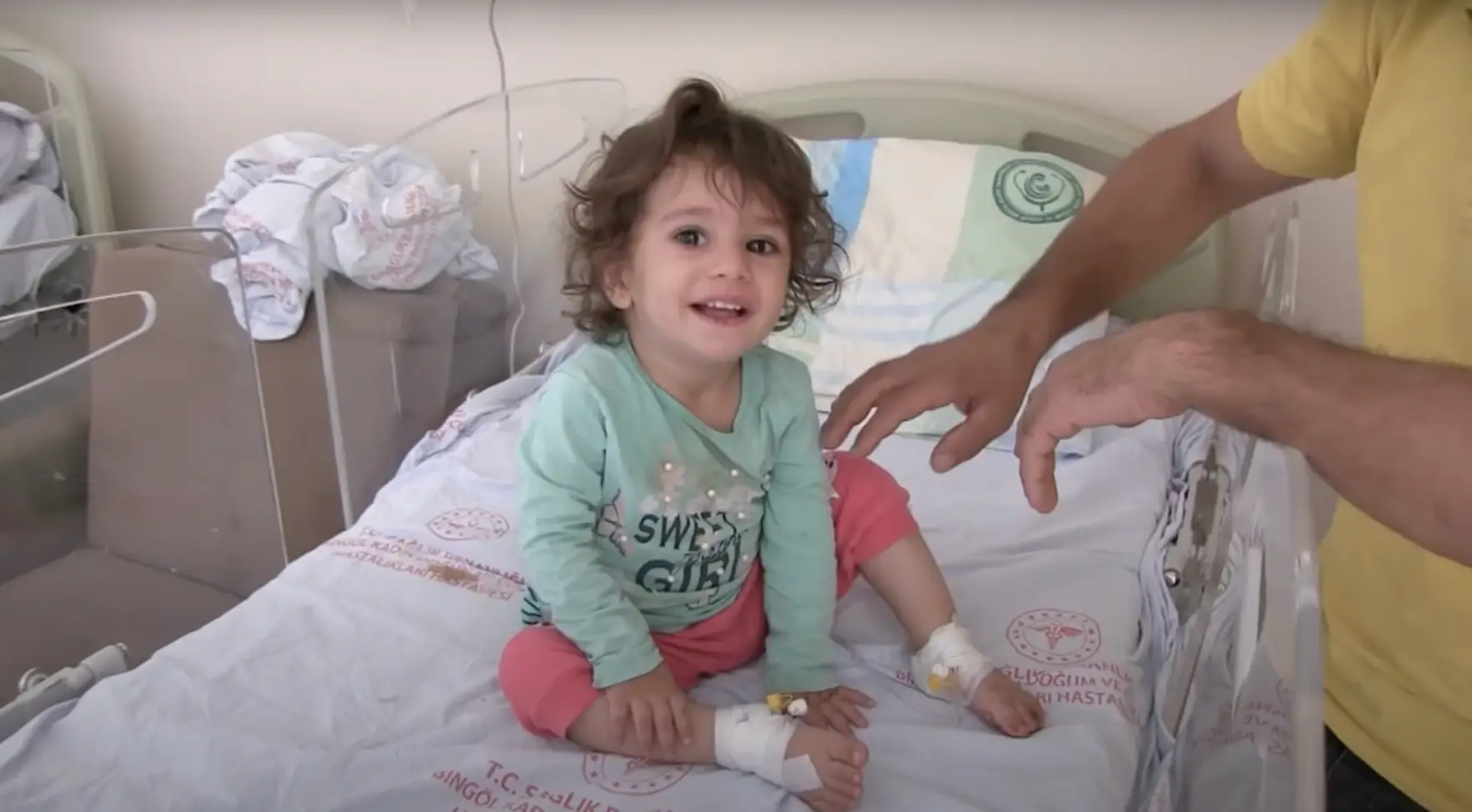 The toddler was found with the snake clamped in her mouth after it had bitten her.