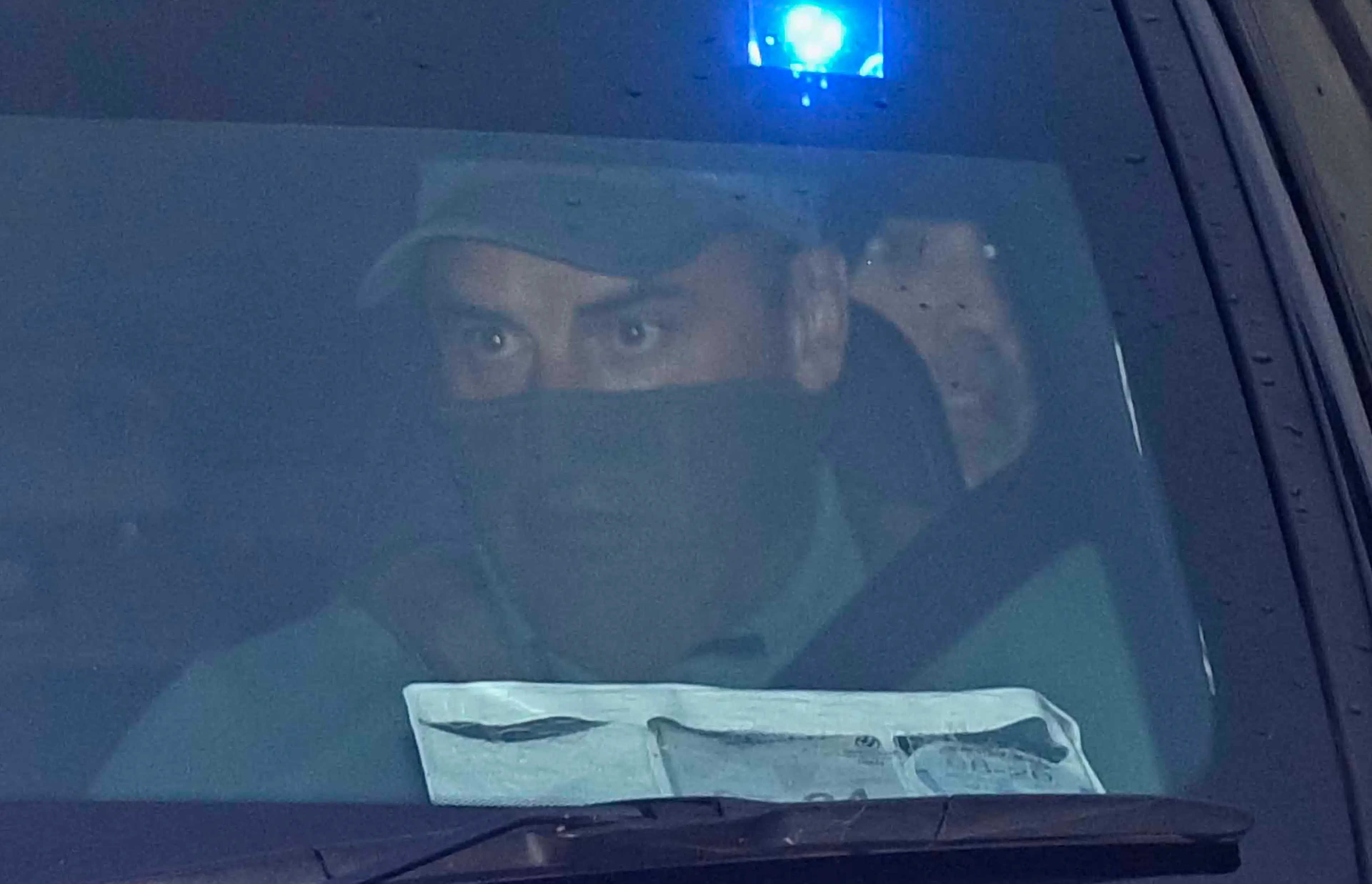Kinahan seen in the back of the police convoy car (Mark Marlow/PA Wire)