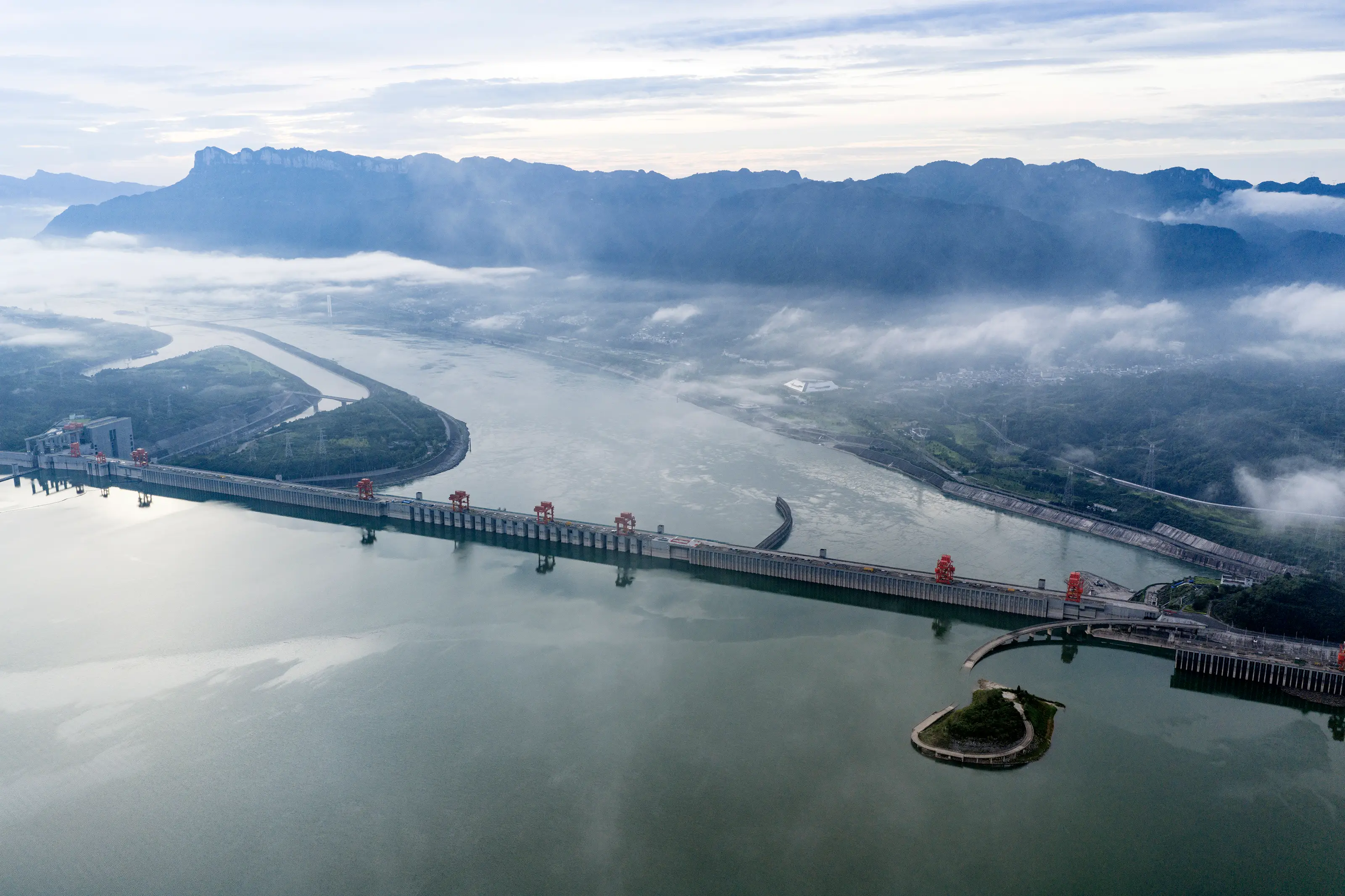 Arial view of the immense Three Gorges Dam shrouded in mist (Costfoto/NurPhoto via Getty Images)