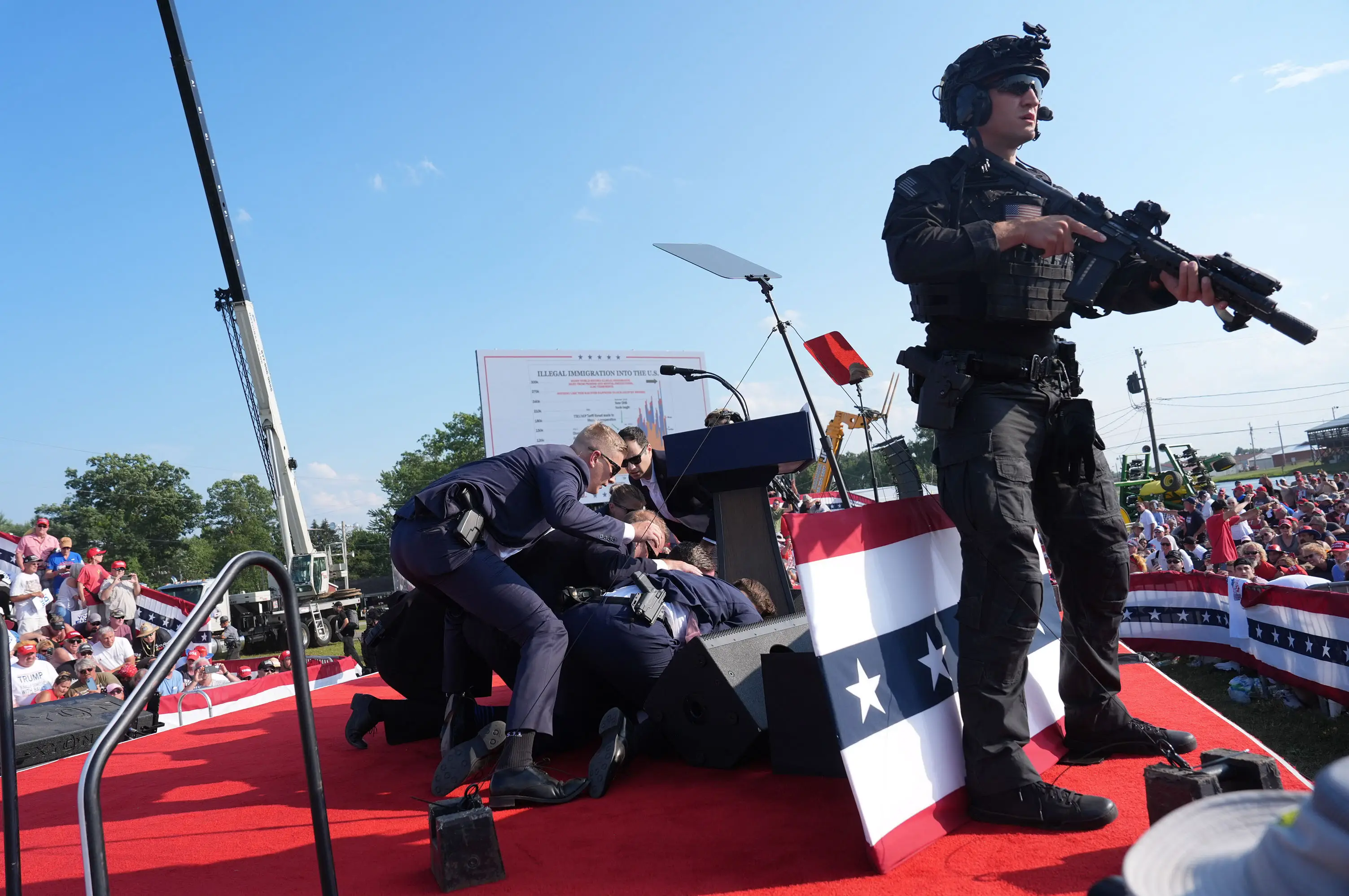 Secret Service agents covered Donald Trump with their bodies, but a security expert wondered how they'd let someone get to a vantage point and line up a shot. (Jabin Botsford/The Washington Post via Getty Images)