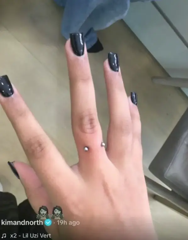 North West's finger piercing previously raised eyebrows (TikTok/@kimandnorth)