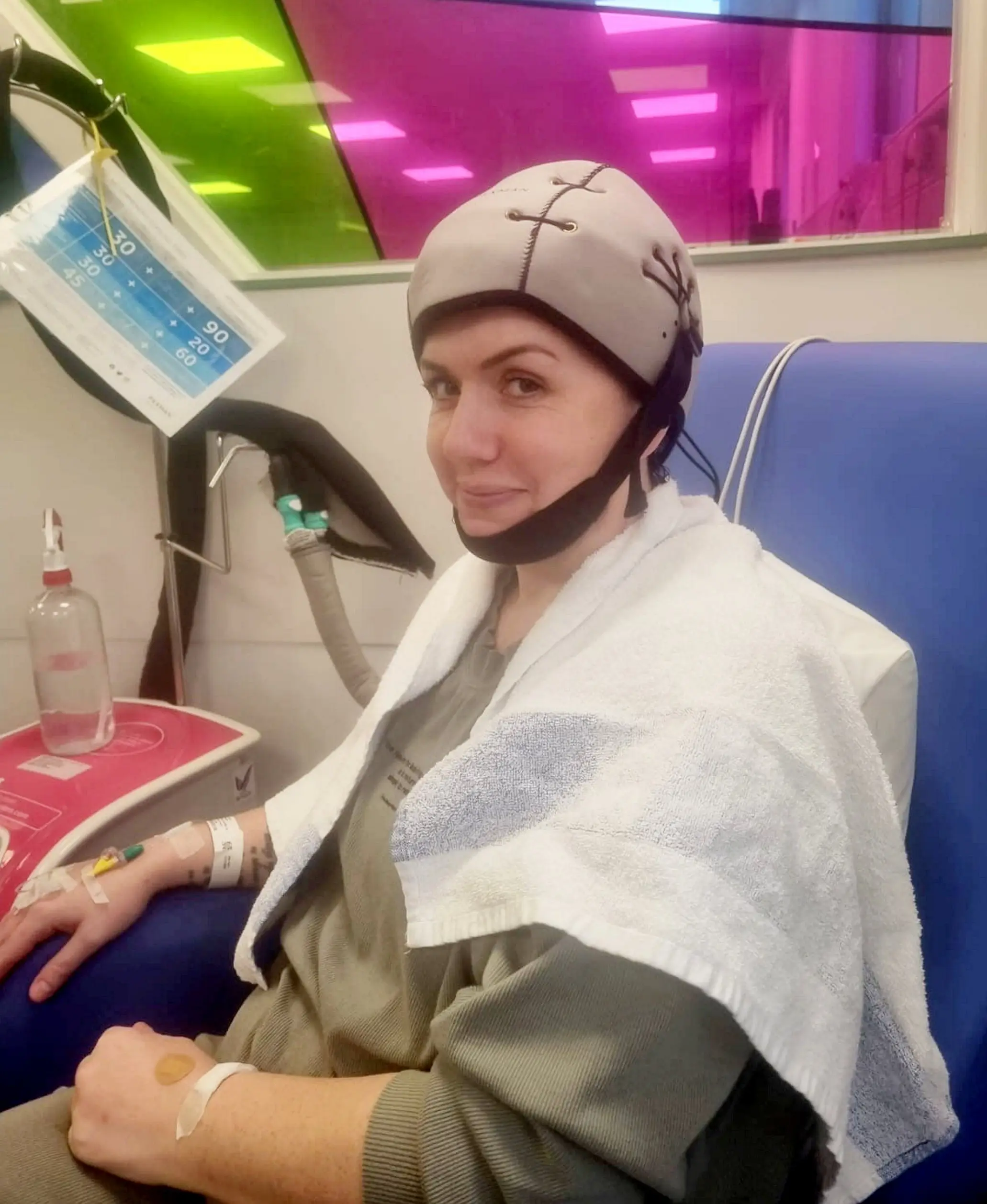 The mum-of-four believes the growth on her ovary 'likely mutated' while waiting for it to be removed (SWNS)