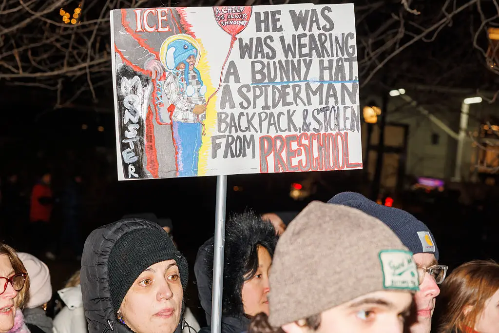 The image of Liam in his blue hat and Spider-Man backpack has been put on placards by protesters  (Jason Alpert-Wisnia / Hans Lucas / AFP via Getty Images)