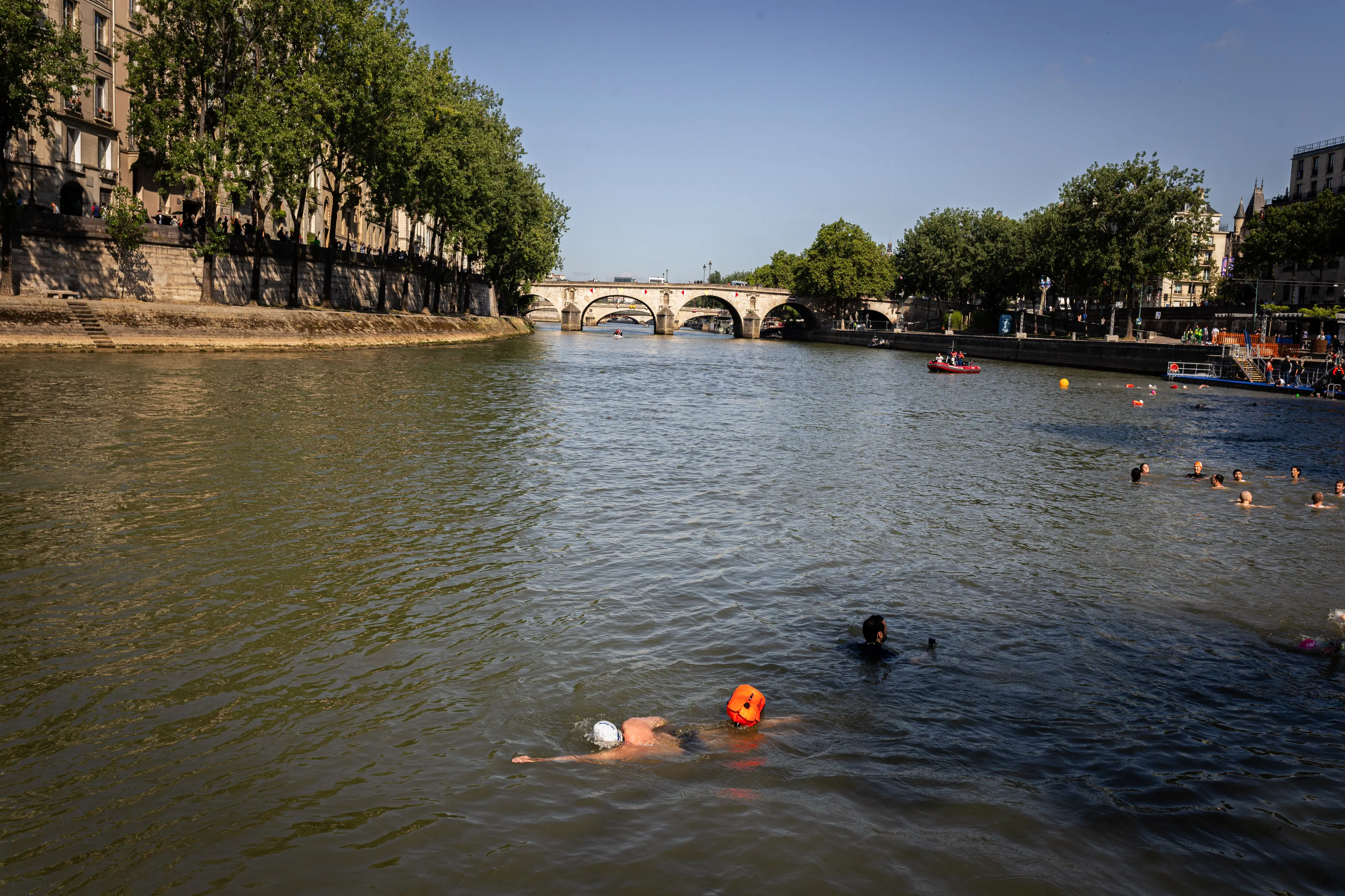 Locals swimming after politicians said the river was now clean enough to swim in for the first time in a century (JULIEN DE ROSA/AFP via Getty Images)