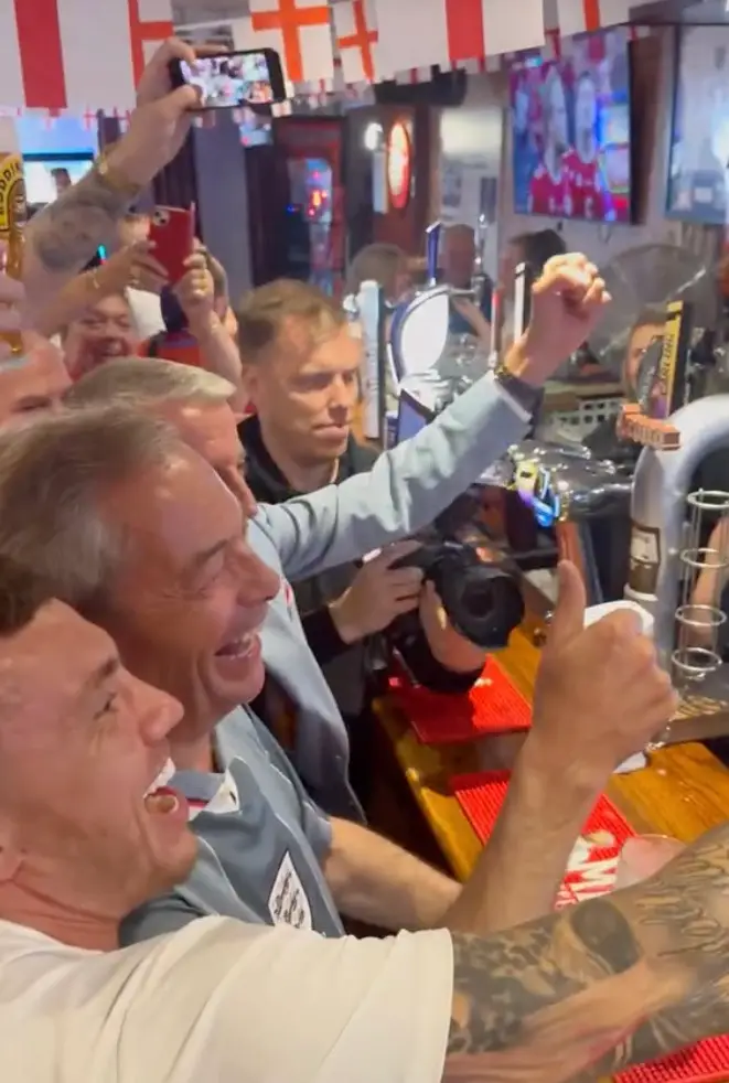 Farage's celebrations were extremely bad timing. (TikTok/@nigel_farage)