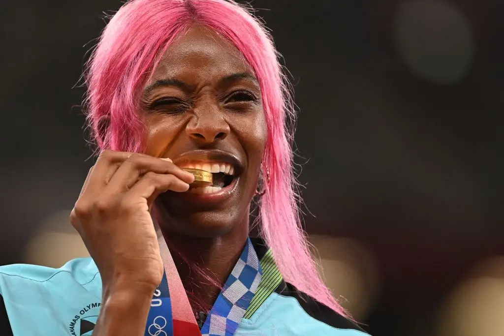 Bahamas gold medallist Shaunae Miller-Uibo bites her medal in the 2020 Games (INA FASSBENDER/AFP via Getty Images)