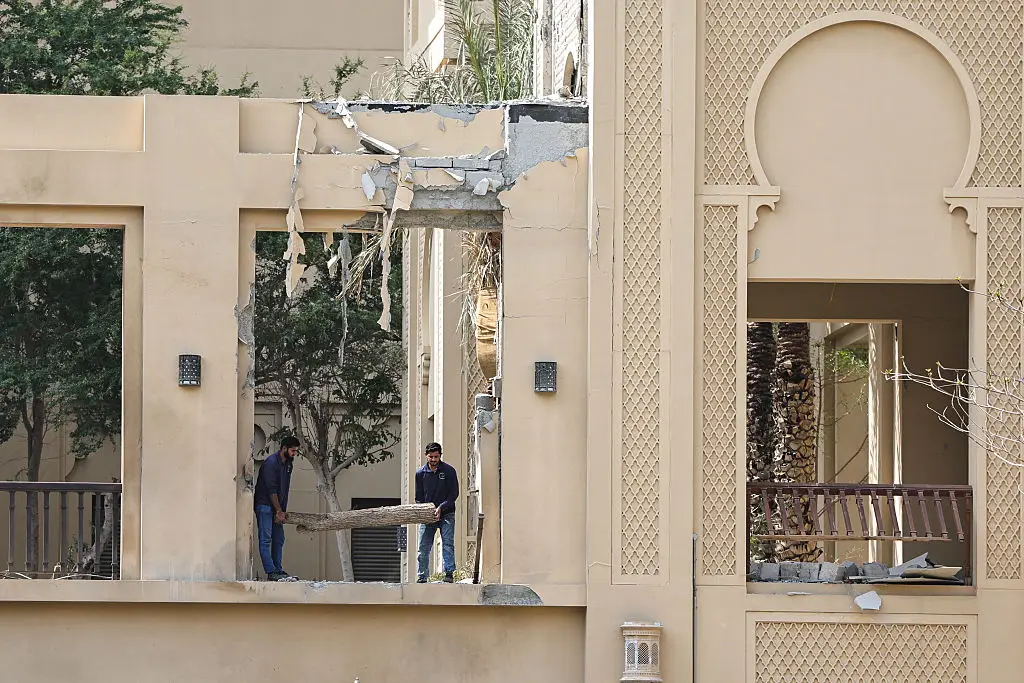 Clean up at the Fairmont hotel in Dubai after it was hit by debris from an Iranian drone on 1 March (Fadel SENNA / AFP via Getty Images)