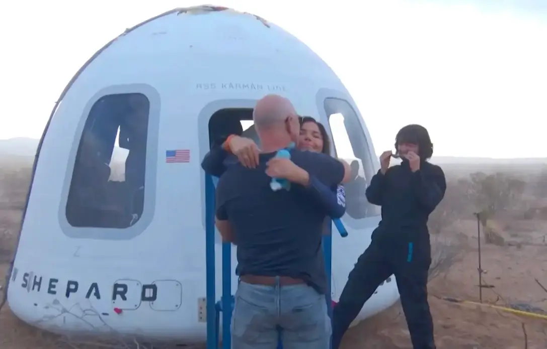 Bezos and Sanchez shared an embrace following the 11-minute space flight (Blue Origin)