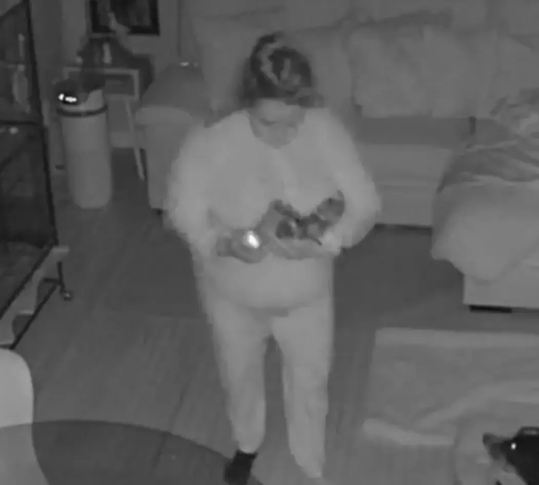 Celina can be seen carrying the cans out to her front lawn.