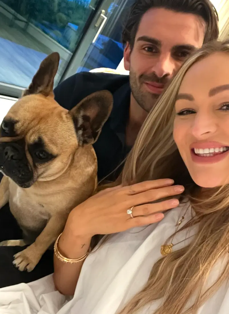 The presenter showed off her ring along with her fiance and dog (Instagram / laurawoodsy)