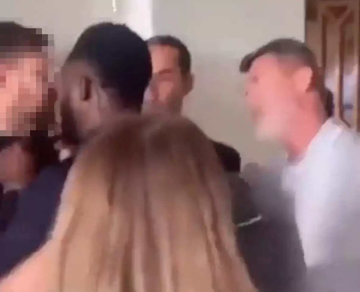 Roya Keane stood to the side of the two men.