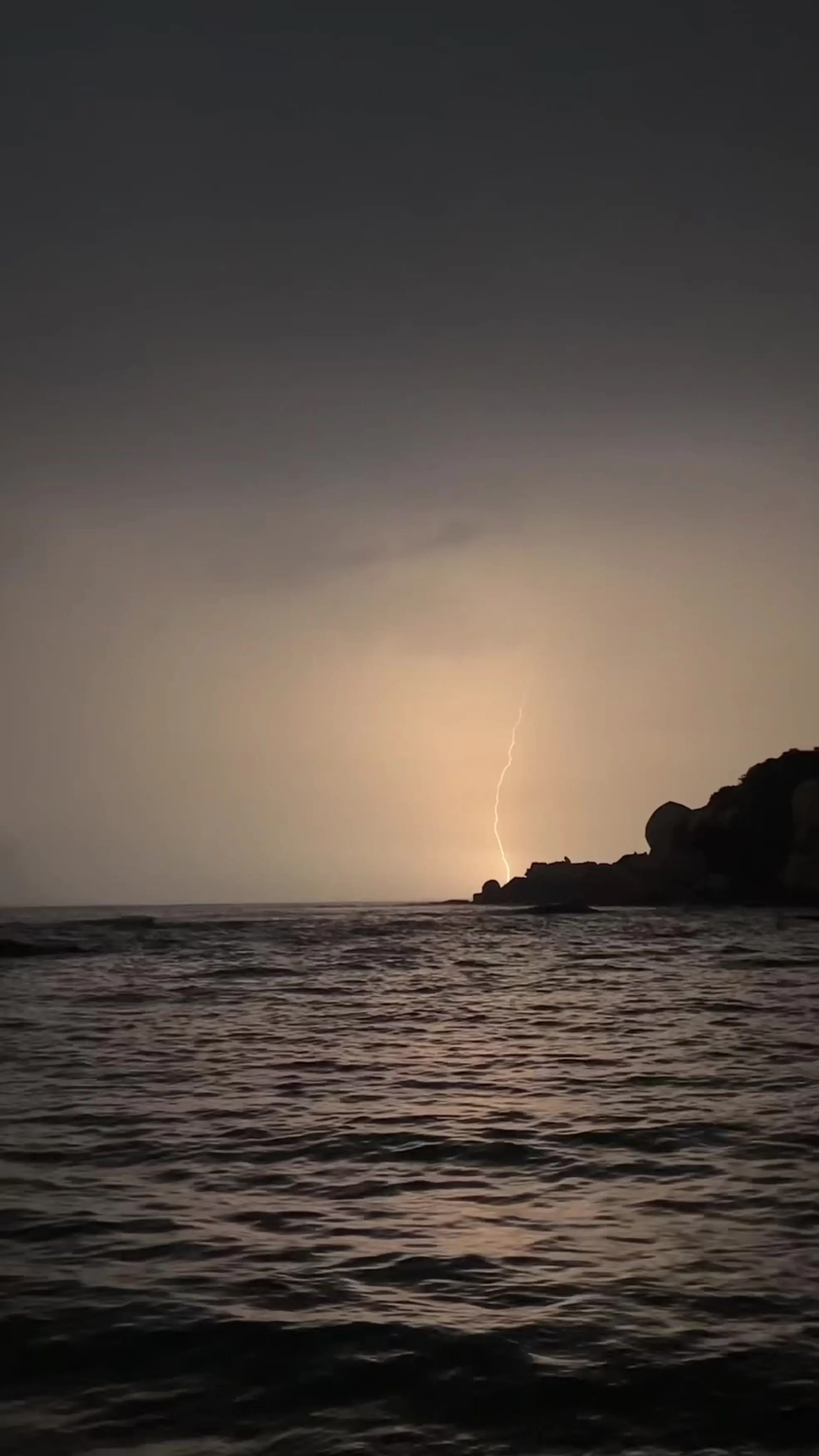 Lightning bolts could be seen striking the sea in the distance (Kennedy News and Media)