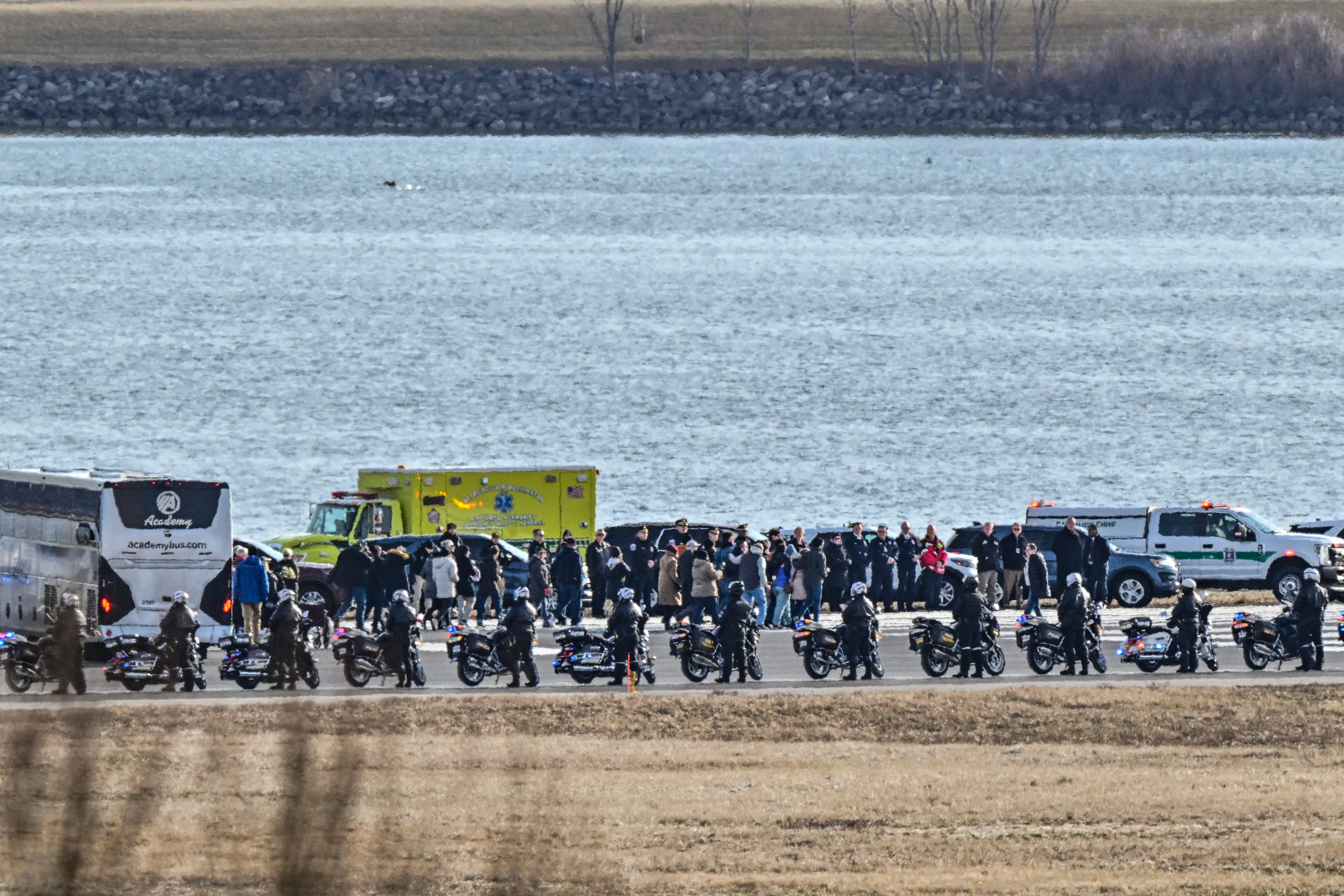 Relatives of the victims gathered at the Potomac River for a memorial yesterday (ROBERTO SCHMIDT/AFP via Getty Images)