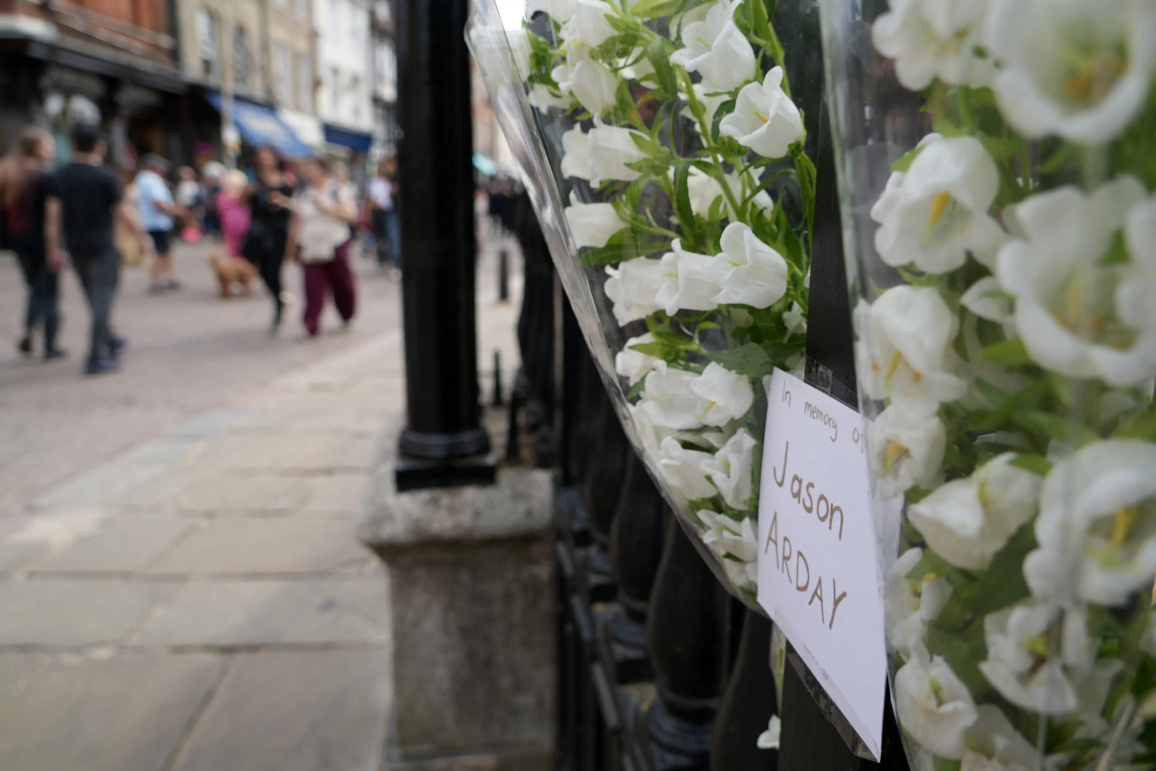 A floral tribute left in memory of Arday on the railings outside Senate House in the University of Cambridge (Justine GERARDY / AFP via Getty Images)