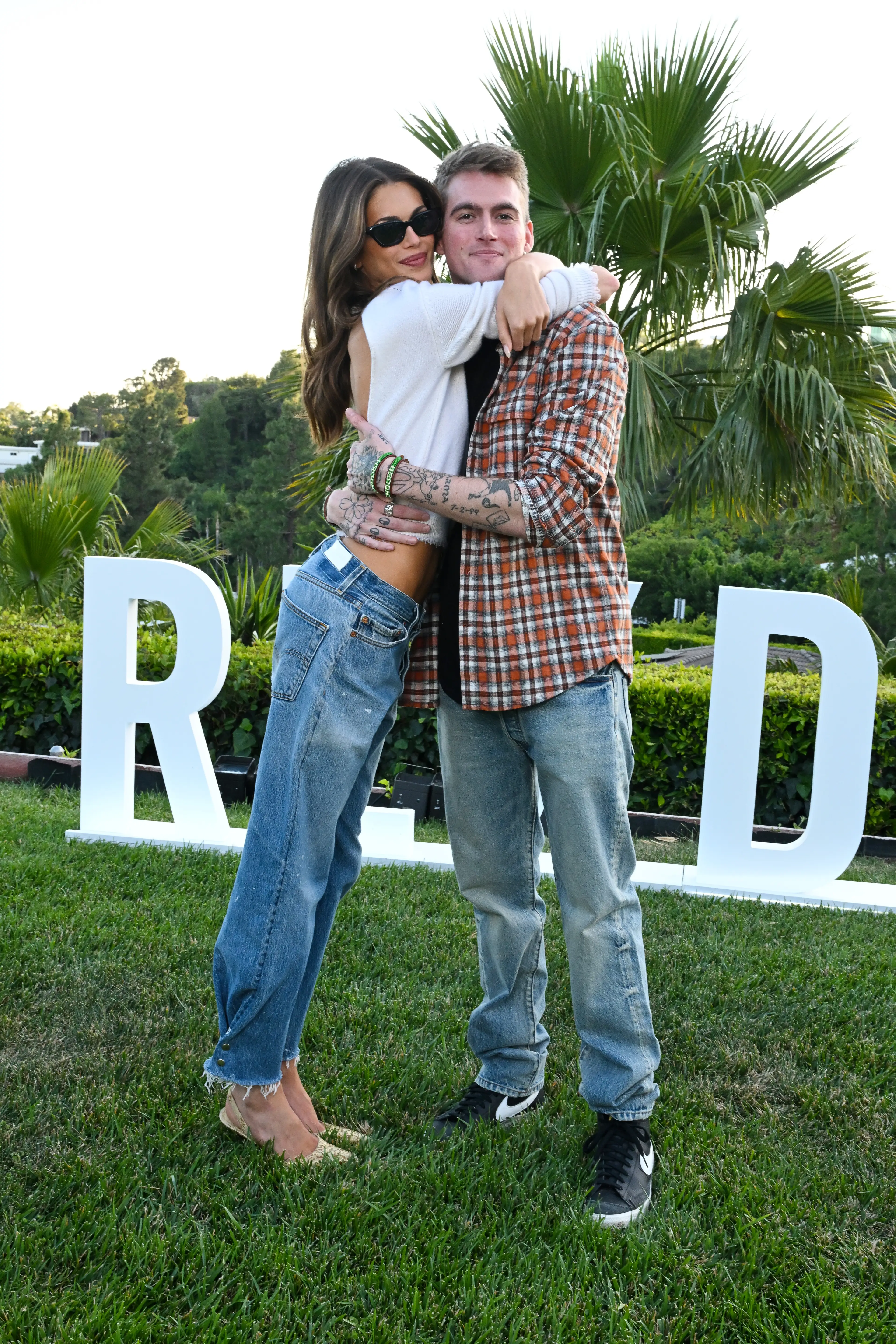 The pair each sported tattoos dedicated to one another (Gilbert Flores/WWD via Getty Images)
