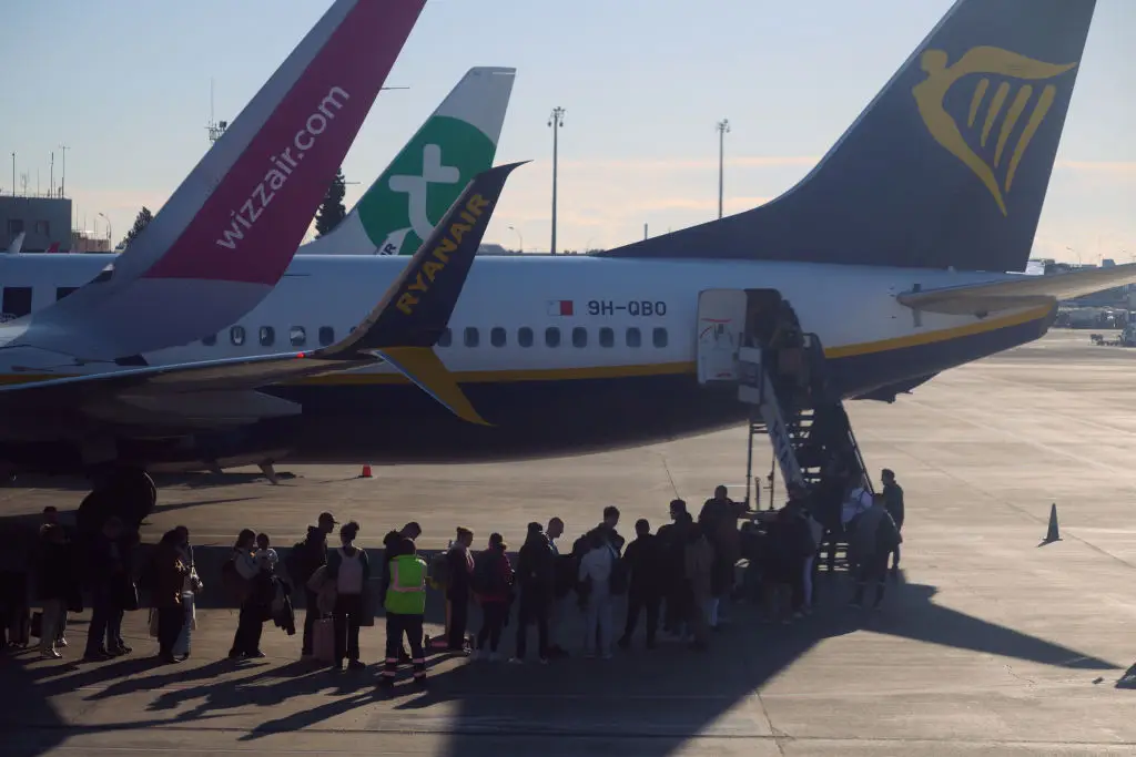 "When I get on board I'm going to ask for a different seat." "Can you not?" (Jaap Arriens/NurPhoto via Getty Images)