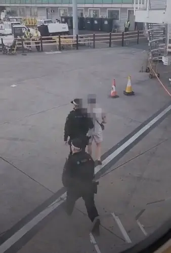 He was led away by police.