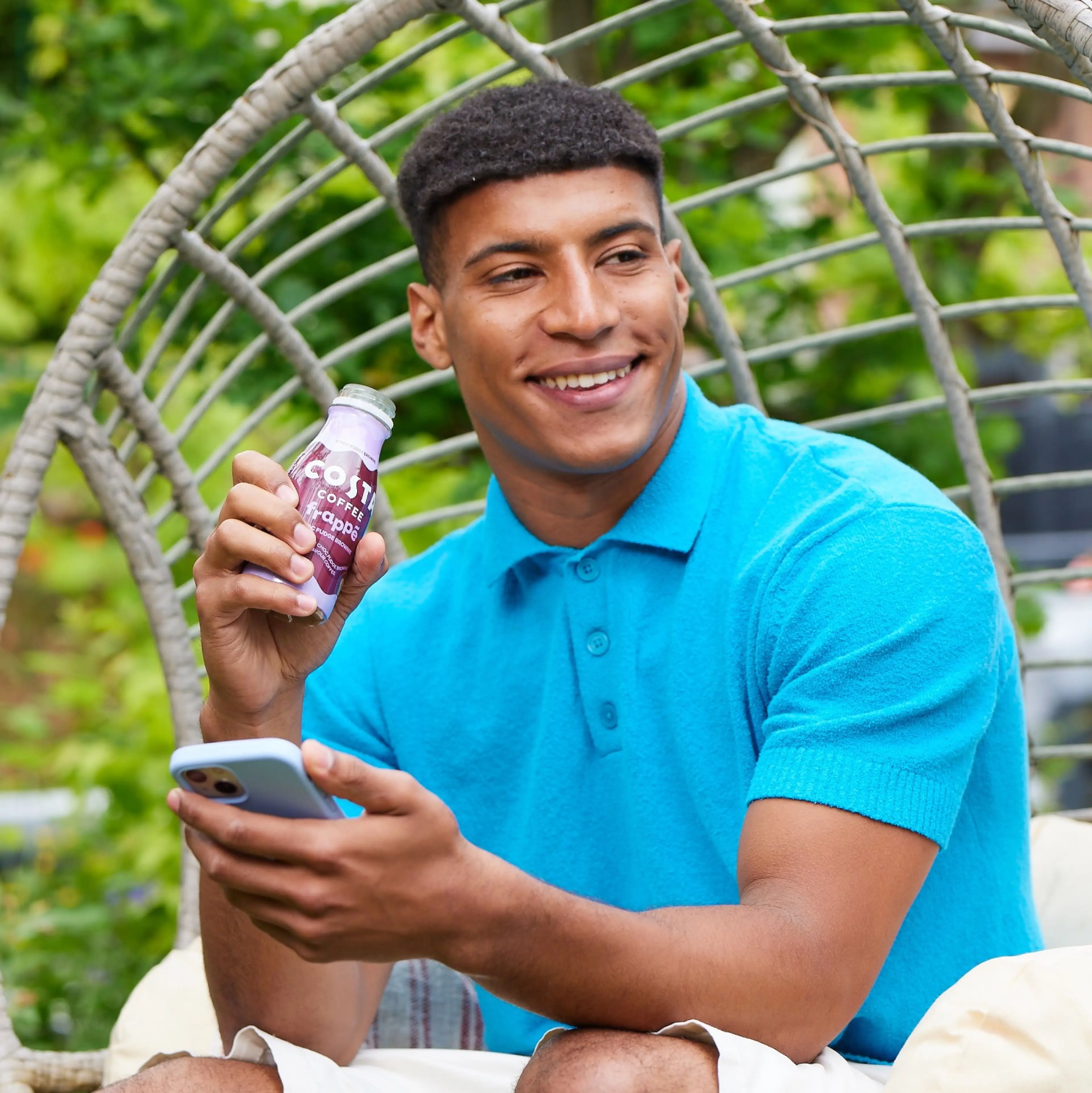 Man drinking Costa coffee