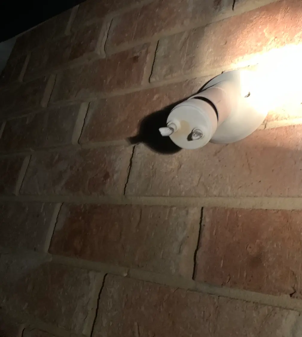 The kids' ball smashed Peter's light.