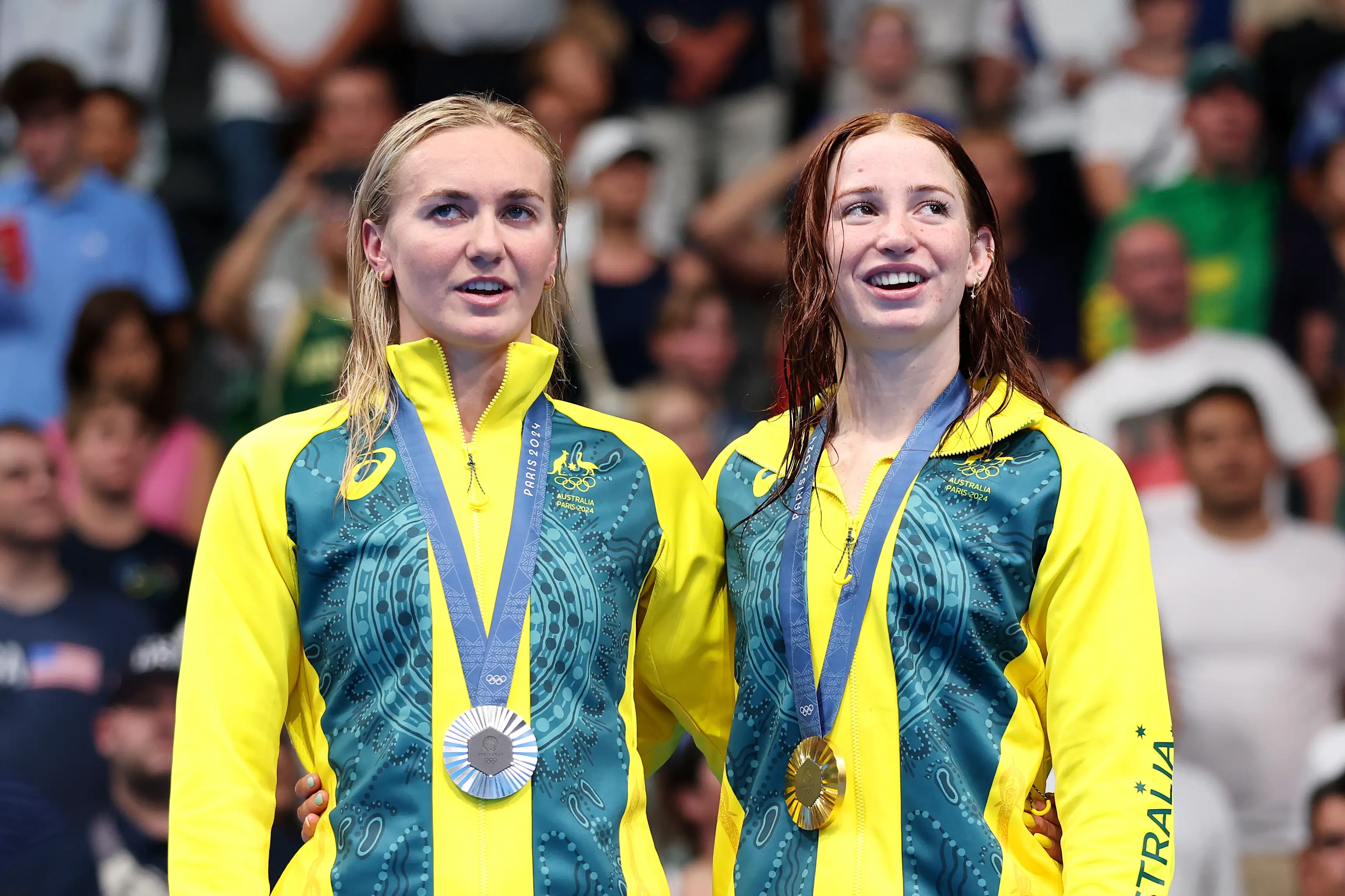 Mollie O'Callaghan (right) took the gold in the 200m and set a new Olympic record, while Titmus has criticised the conditions in the Olympic village. (Sarah Stier/Getty Images)