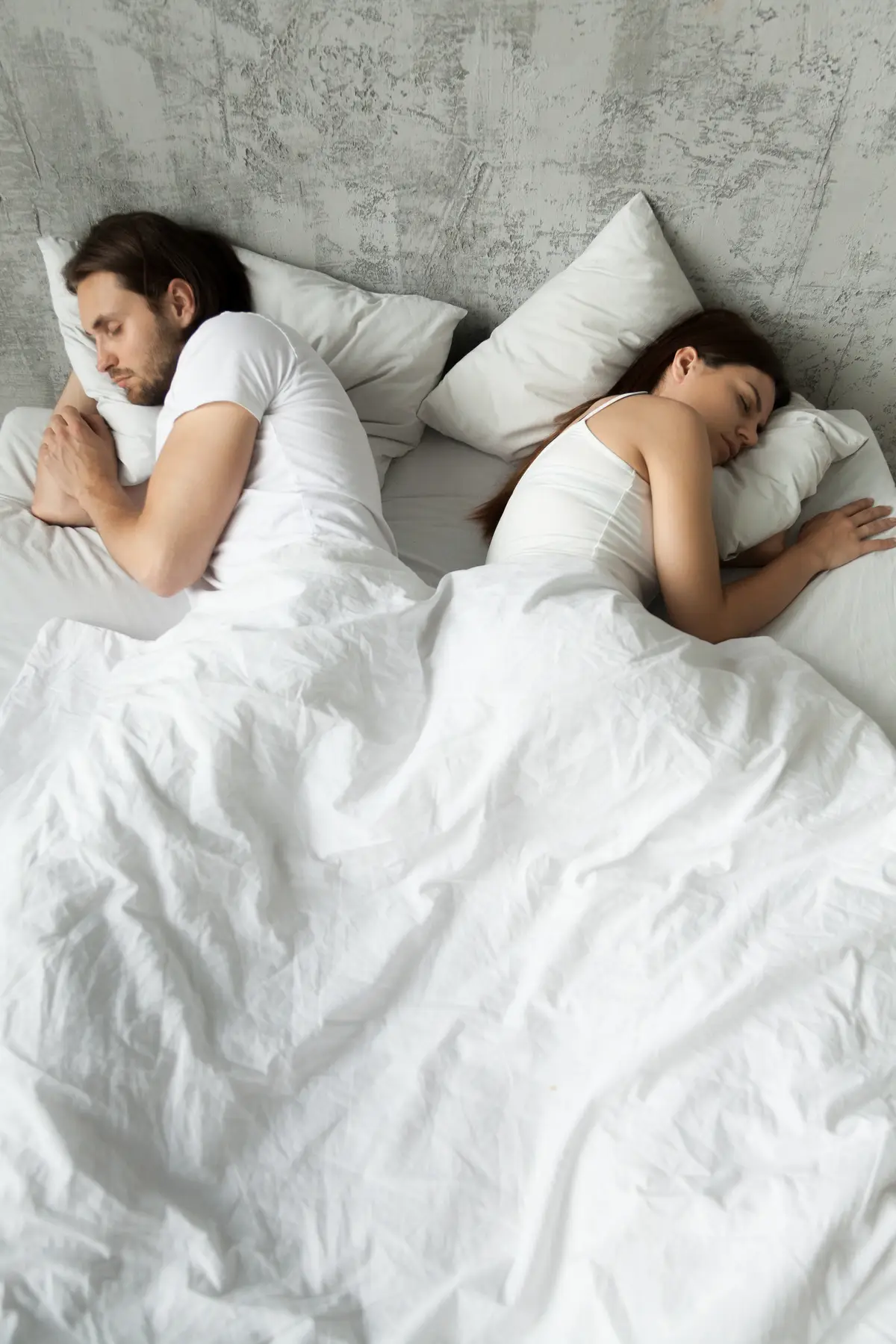 A lot of couples are opting to 'sleep divorce' to try and get enough hours in (Getty Stock Photo)
