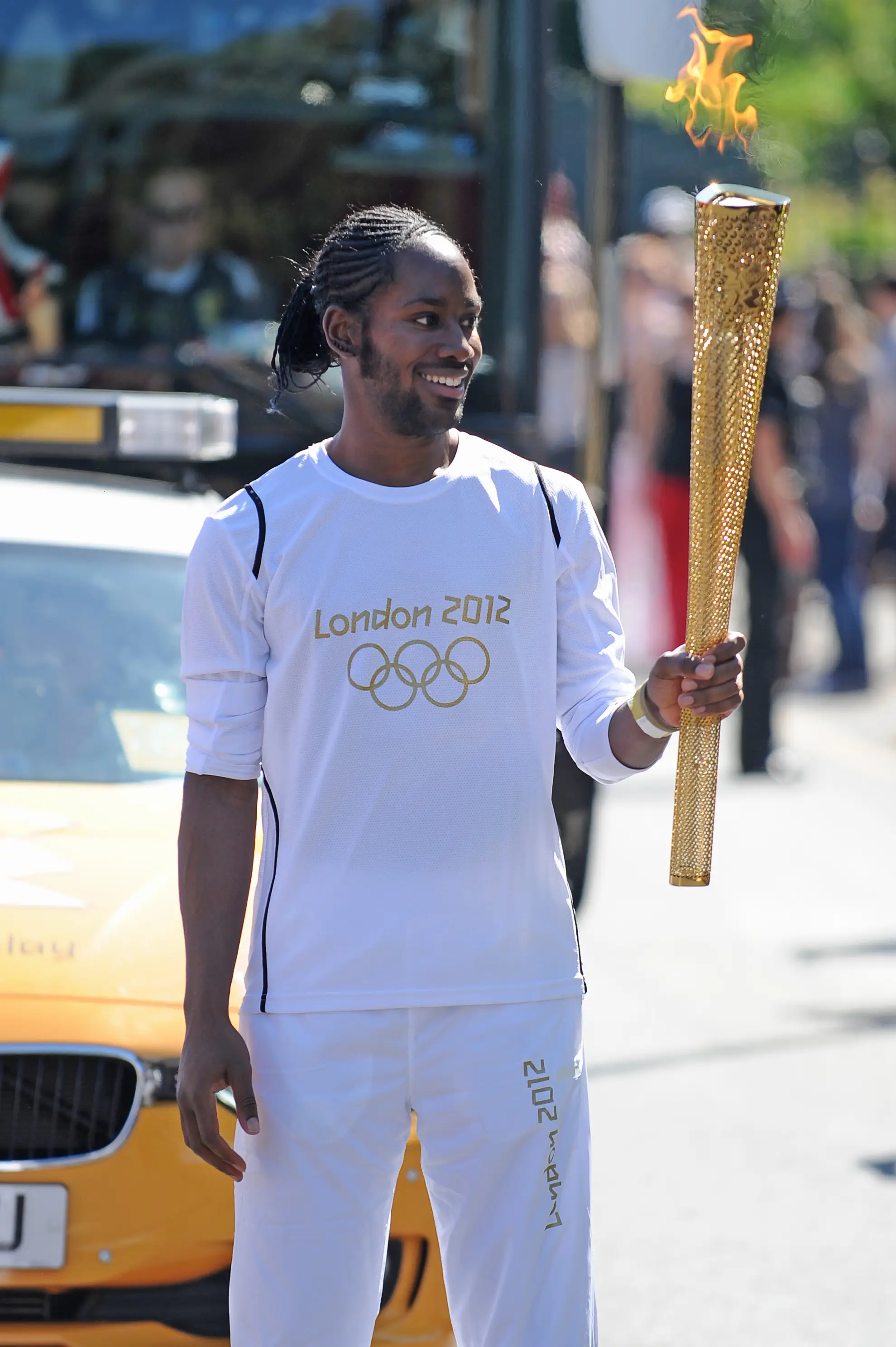 Arday seen carrying the Olympic Flame during the Torch Relay in 2012 (Joe Giddens/LOCOG/PA Wire)