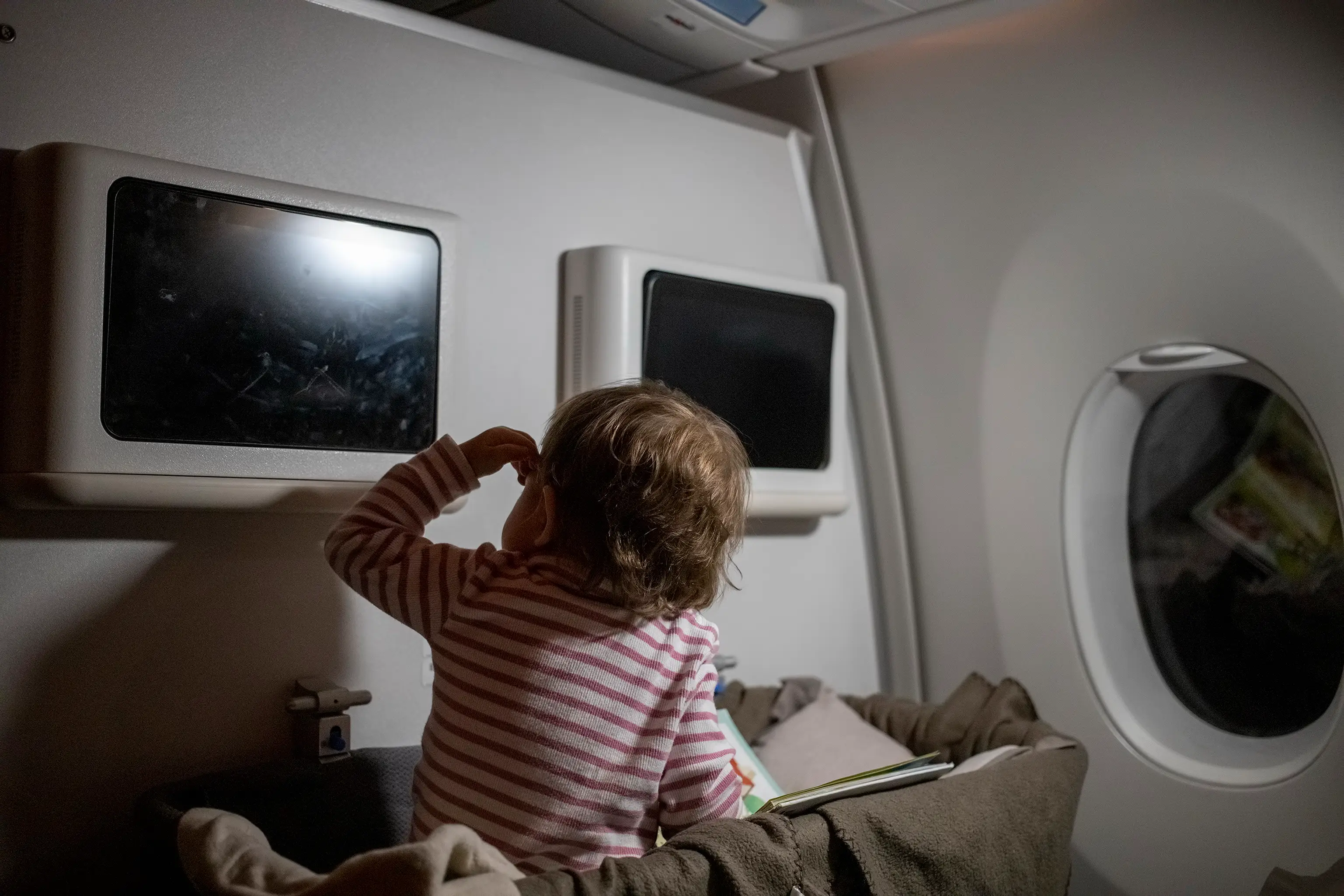 Some plane seats are located by walls for cots. (Getty Stock)