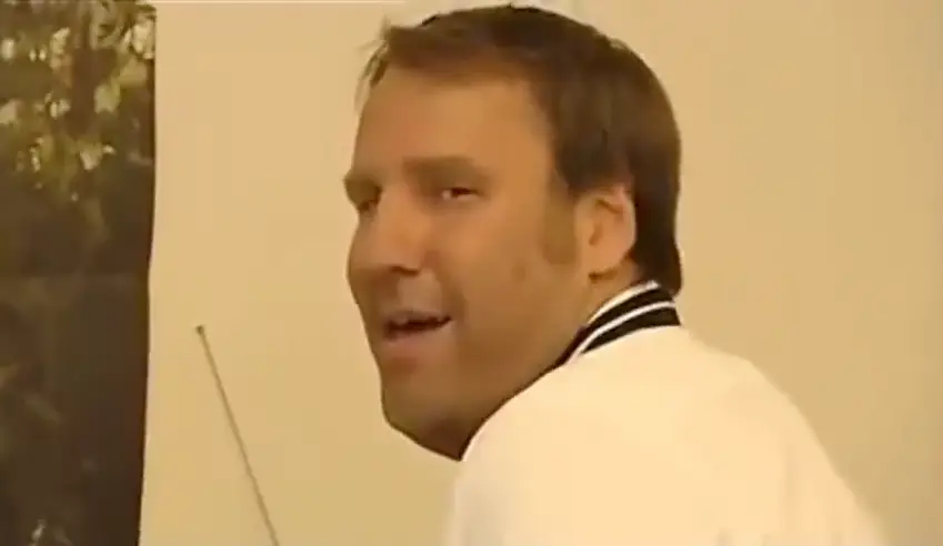 The camera then pans towards Merson, who implies that he's actually playing with himself, rather than the trophies.