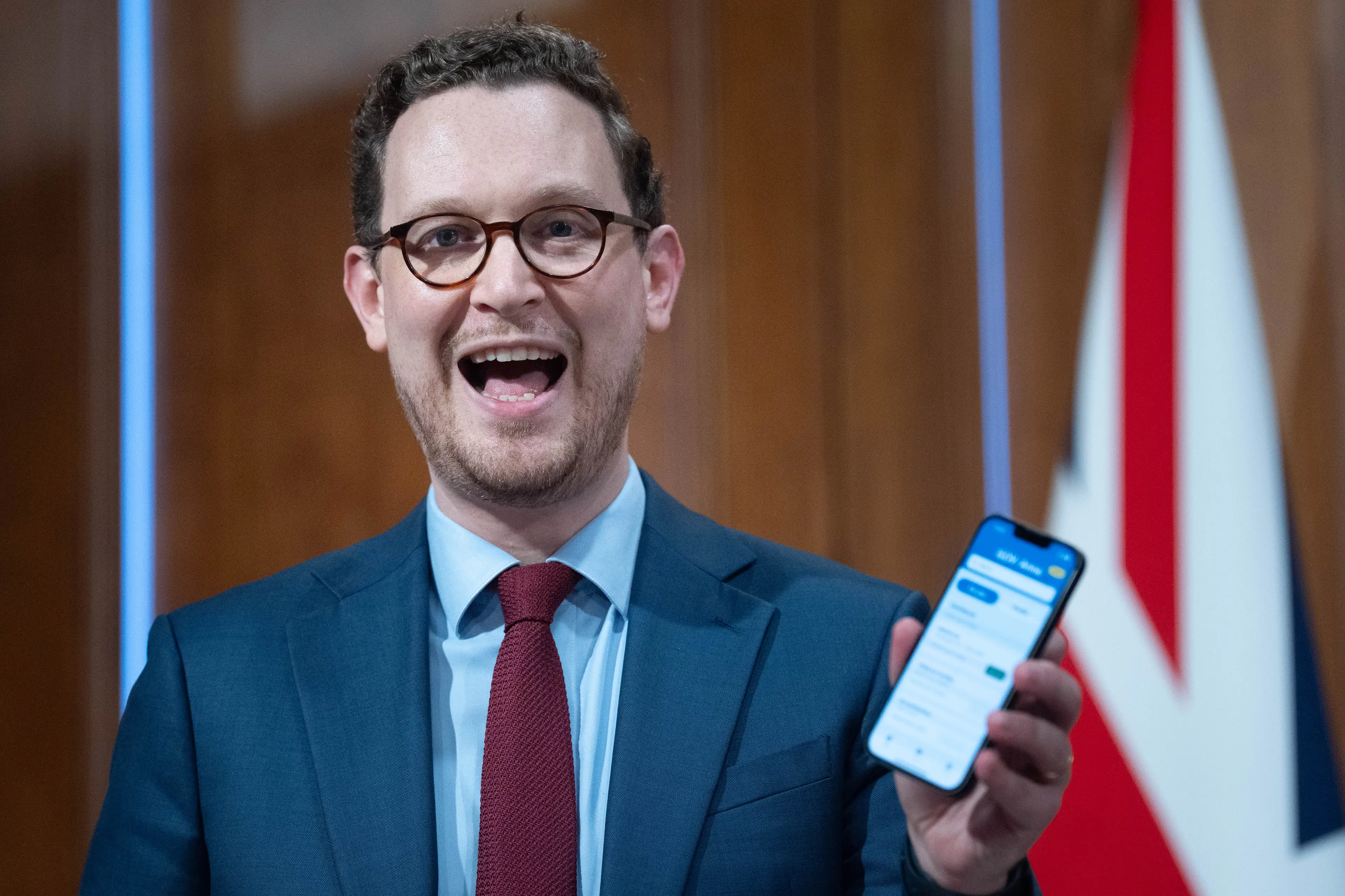 Chief Secretary to the Prime Minister Darren Jones in March with a prototype of the "Government by app" underpinned by digital ID.