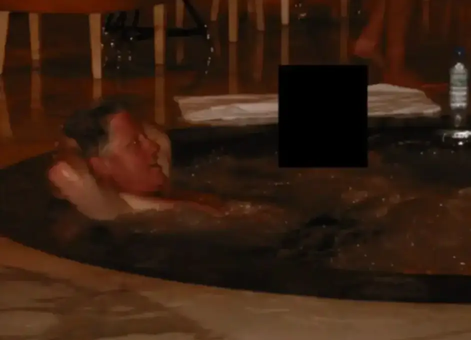 Bill Clinton was photographed in a hot tub with an unknown person (DOJ)