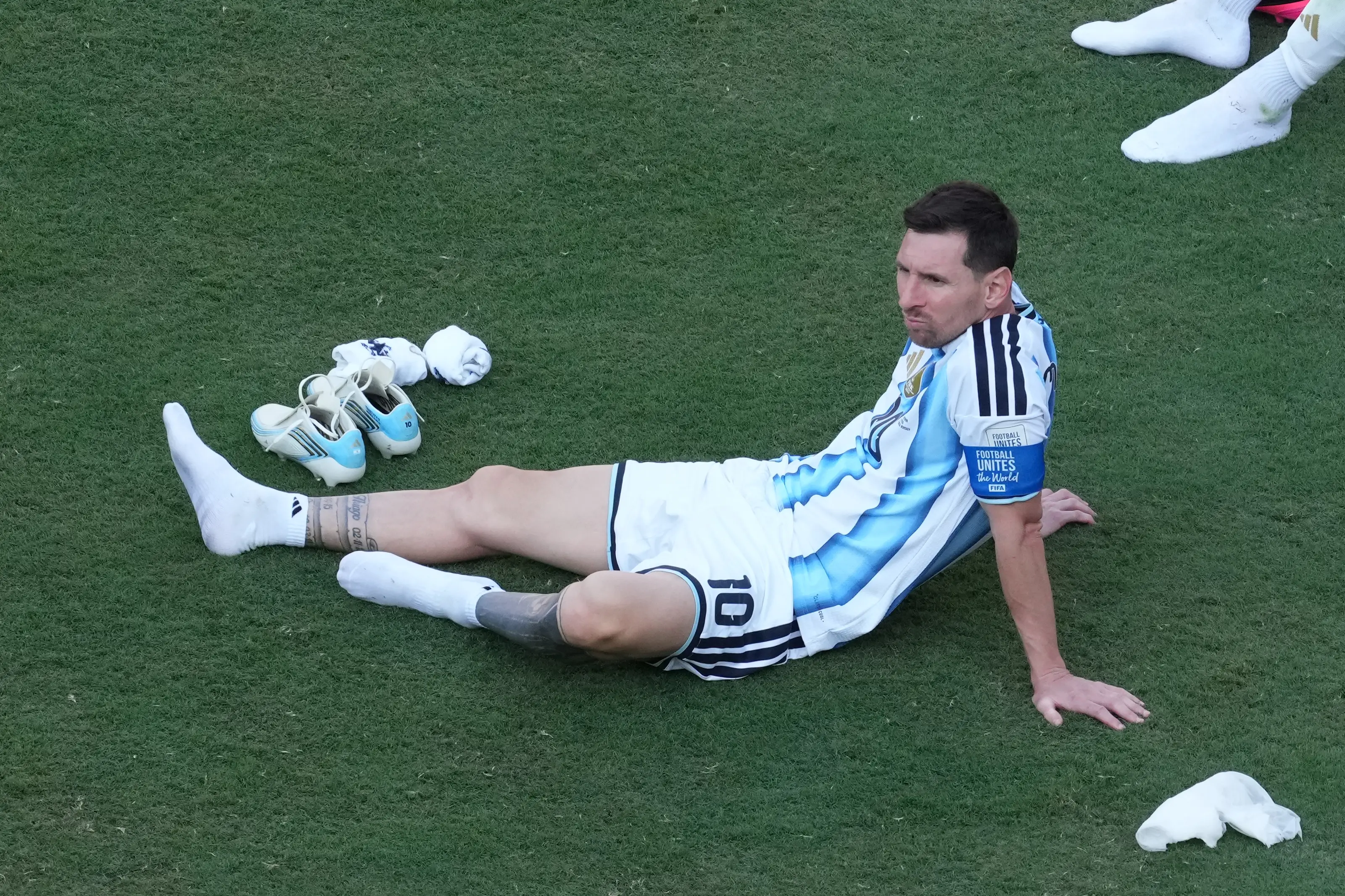Messi was seen looking glum after the game (Masashi Hara/Getty Images)