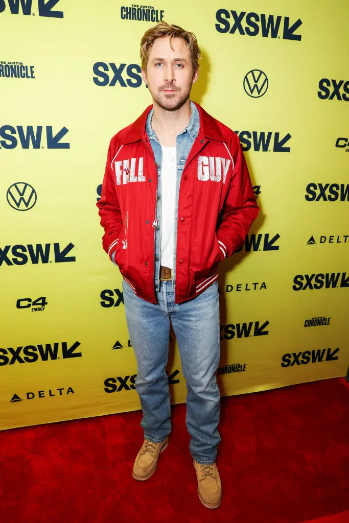 Ryan gosling can be seen sat in the middle of the photo.